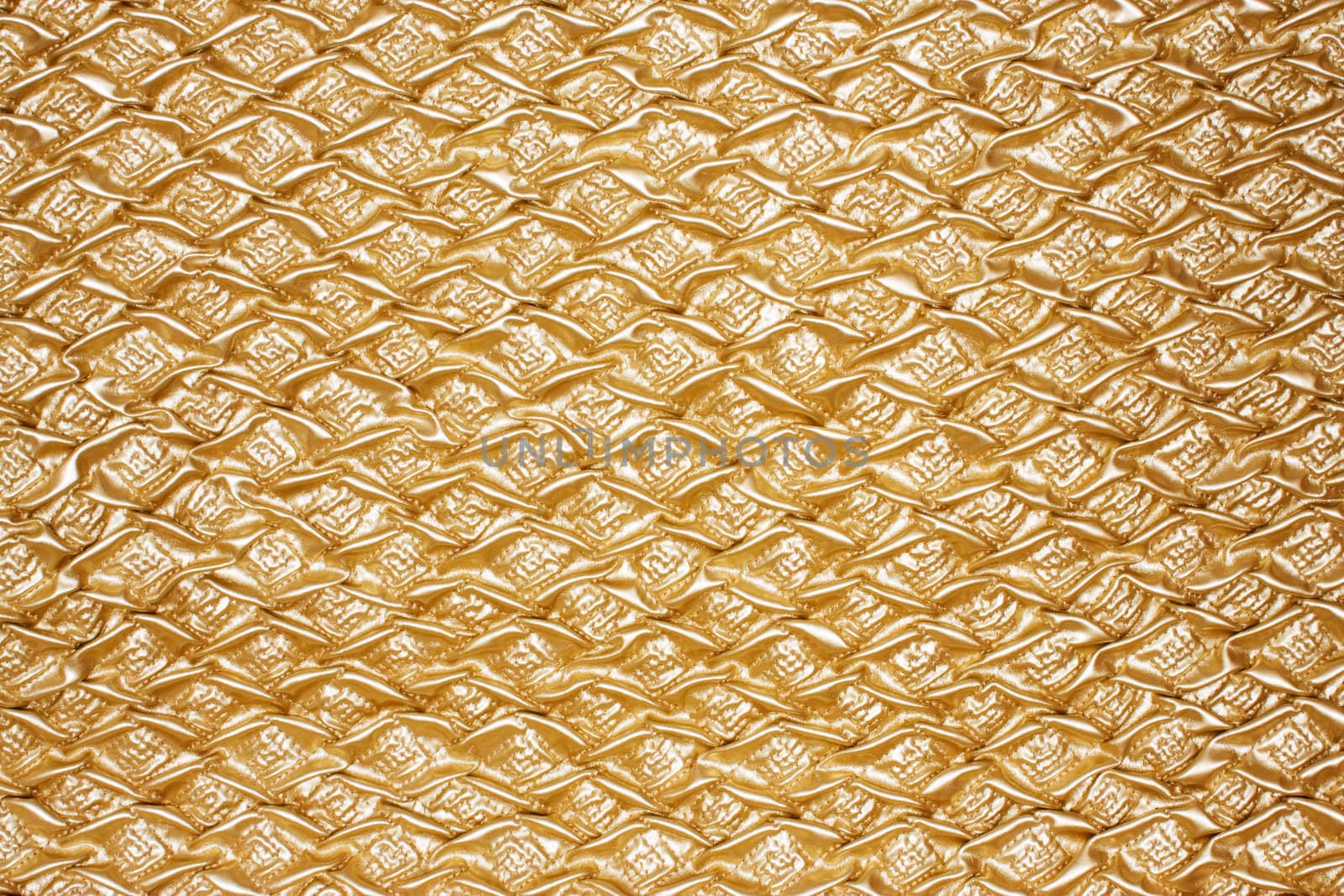 Golden close-up textured oilcloth or leather for background