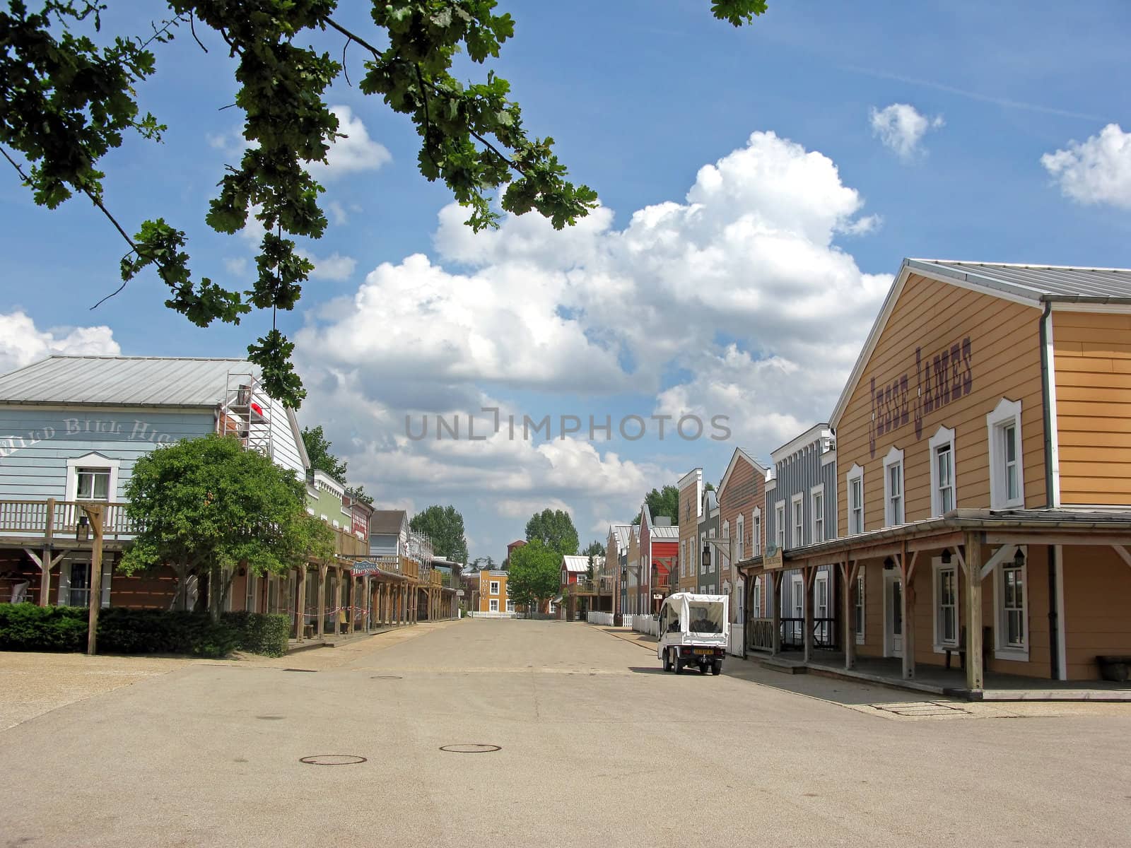 A deserted cowboy town, with wooden buildings.