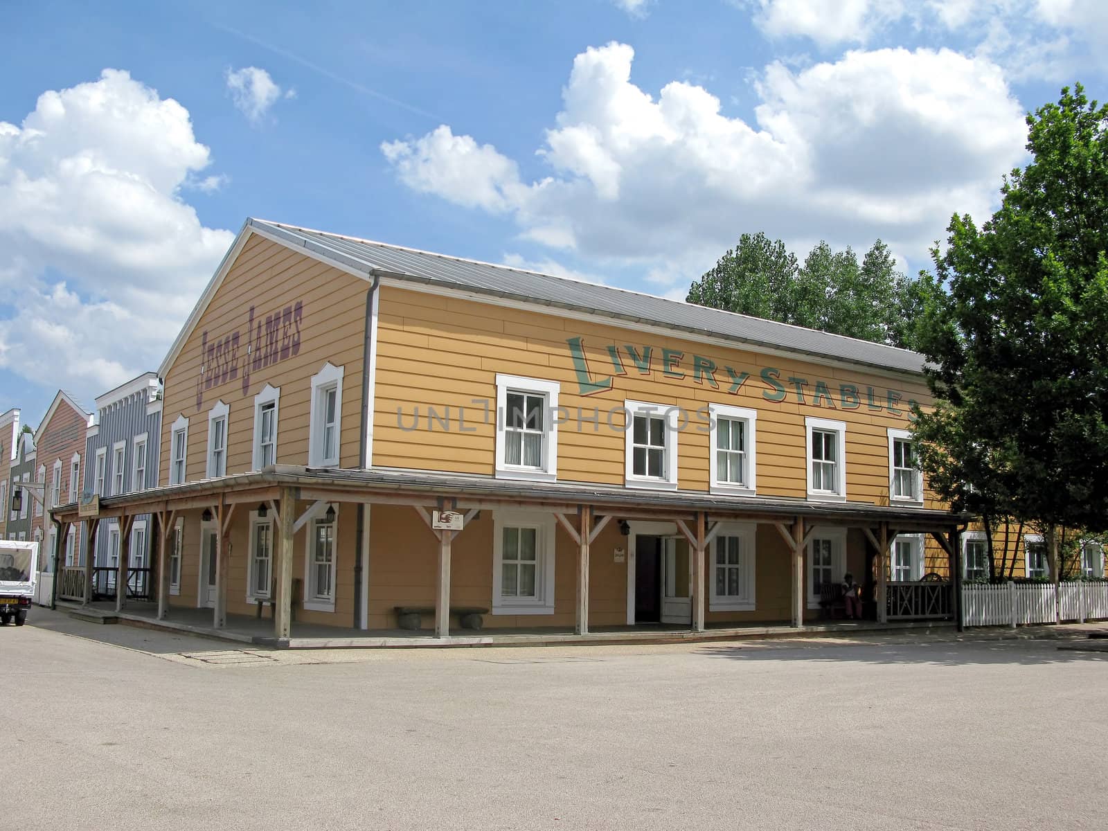 A deserted cowboy town, with wooden buildings.