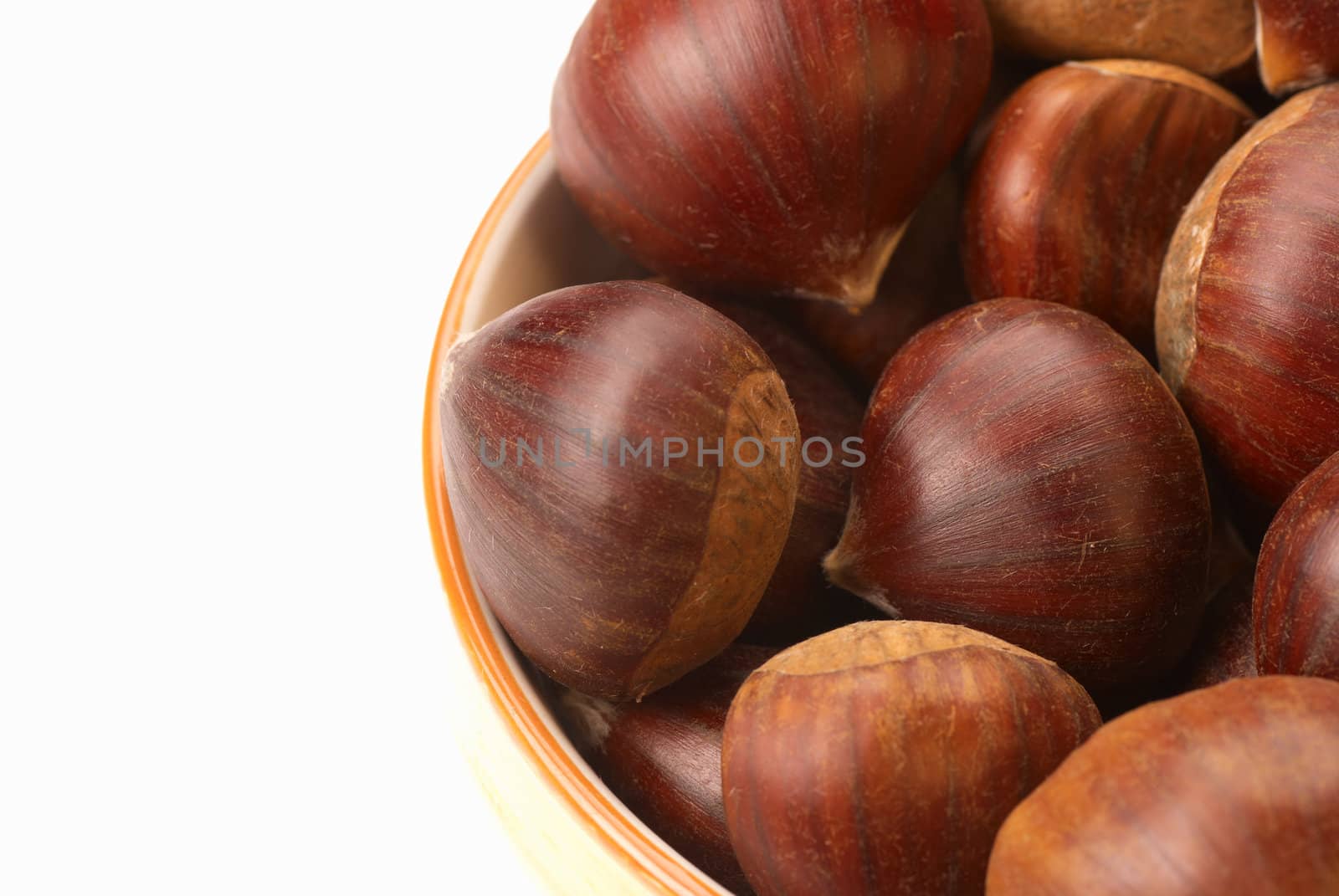 A bowl of fresh chestnuts with copy space