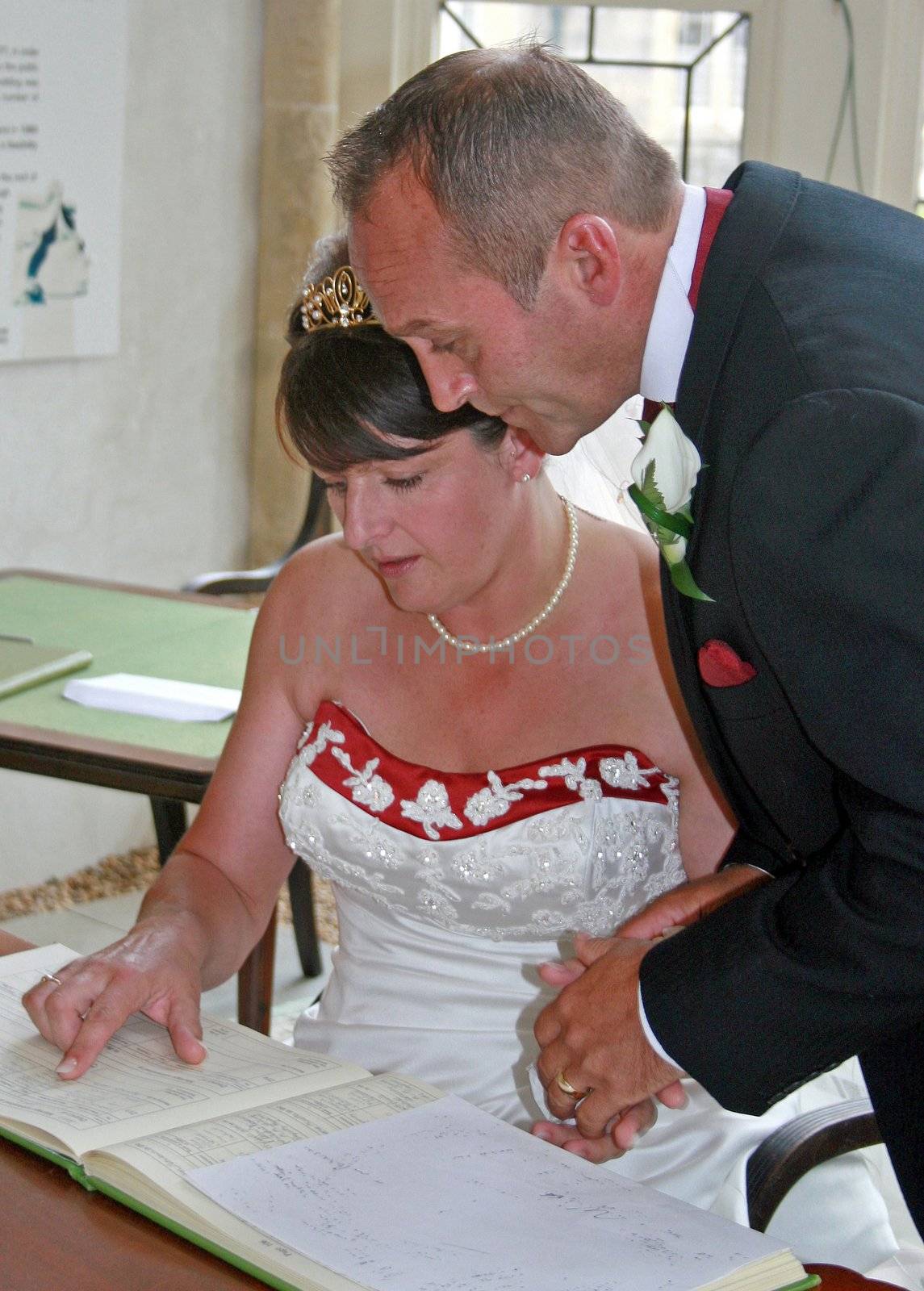 Bride and Groom signing the register by quackersnaps