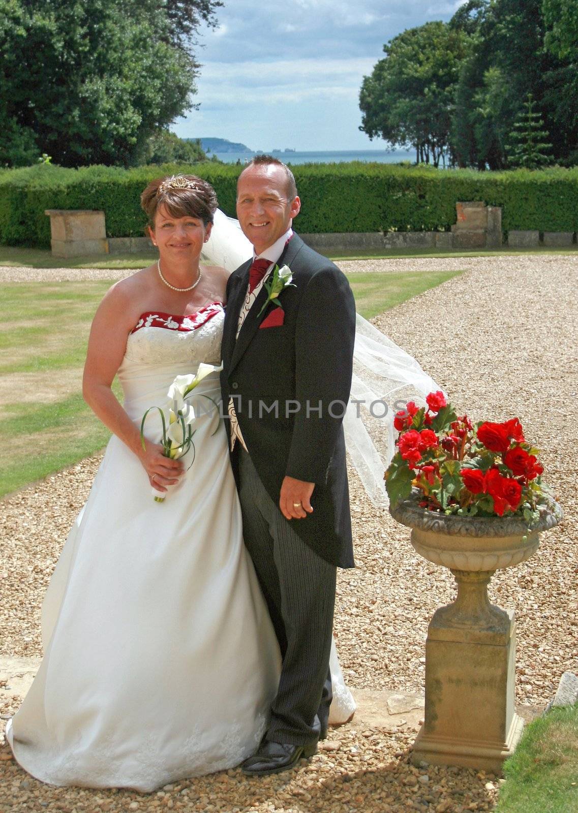 Bride and Groom in the countryside with Roses