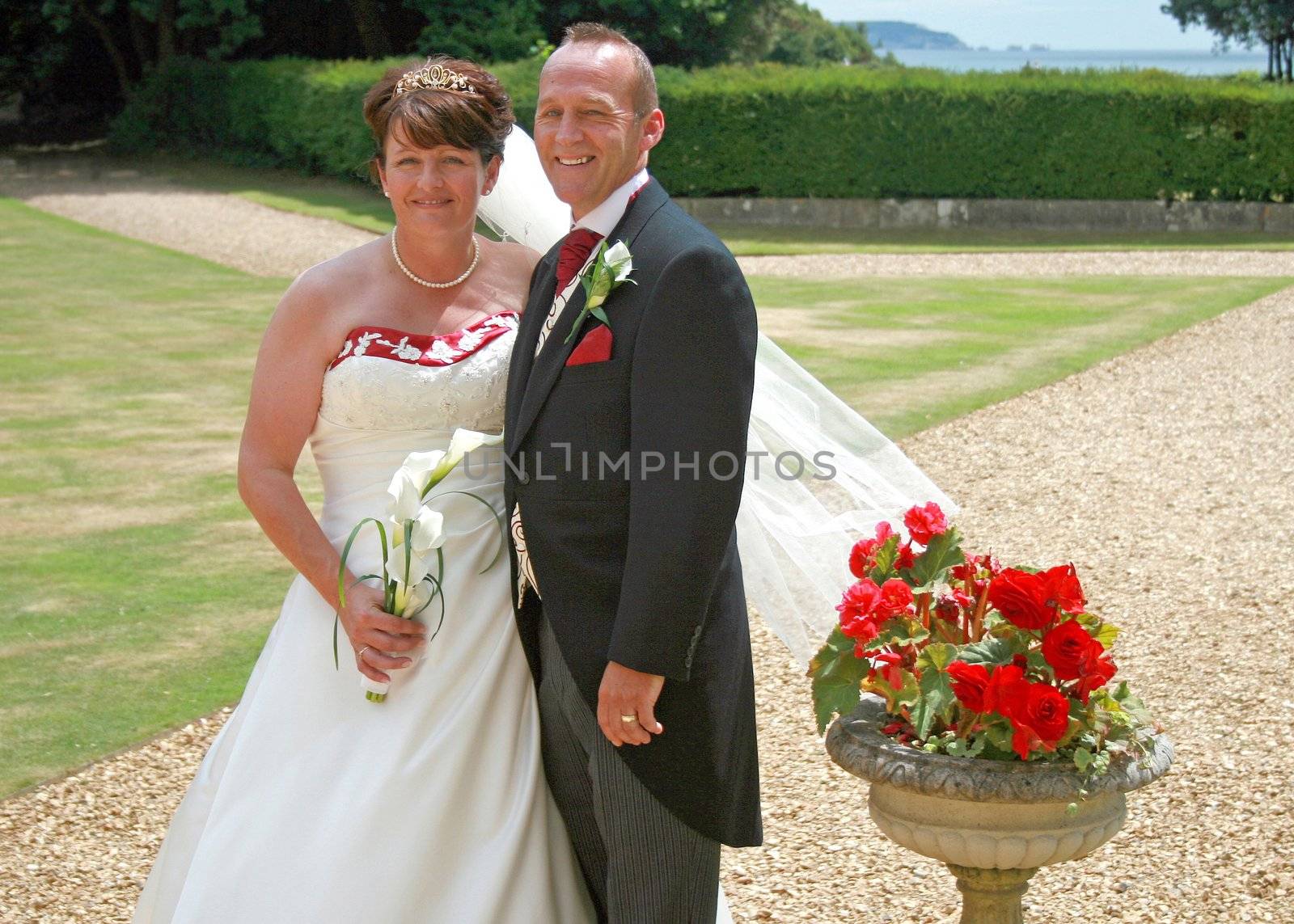 Bride and Groom with Roses by quackersnaps