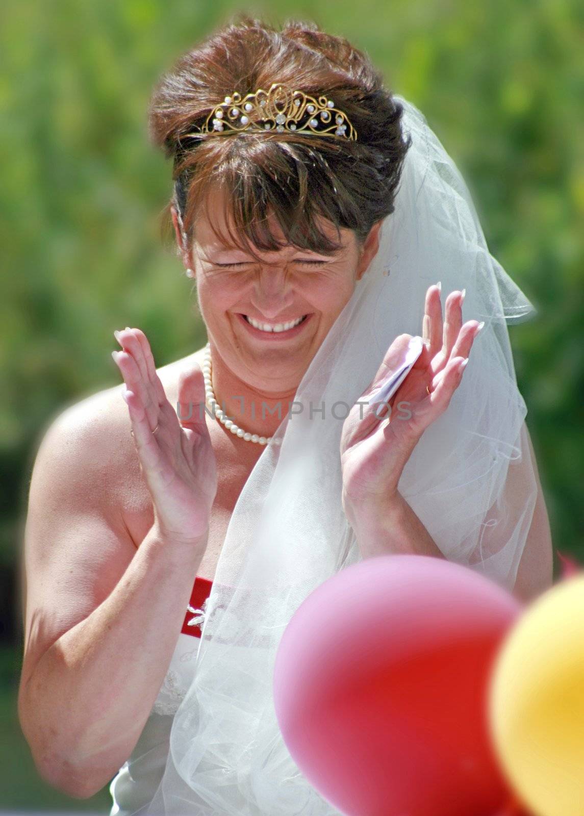 The Bride laughing at the reception after the wedding