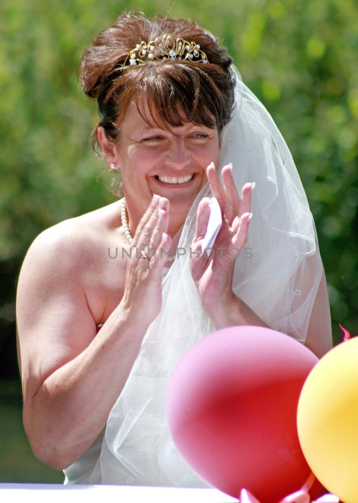 The Bride laughing at the reception after the wedding