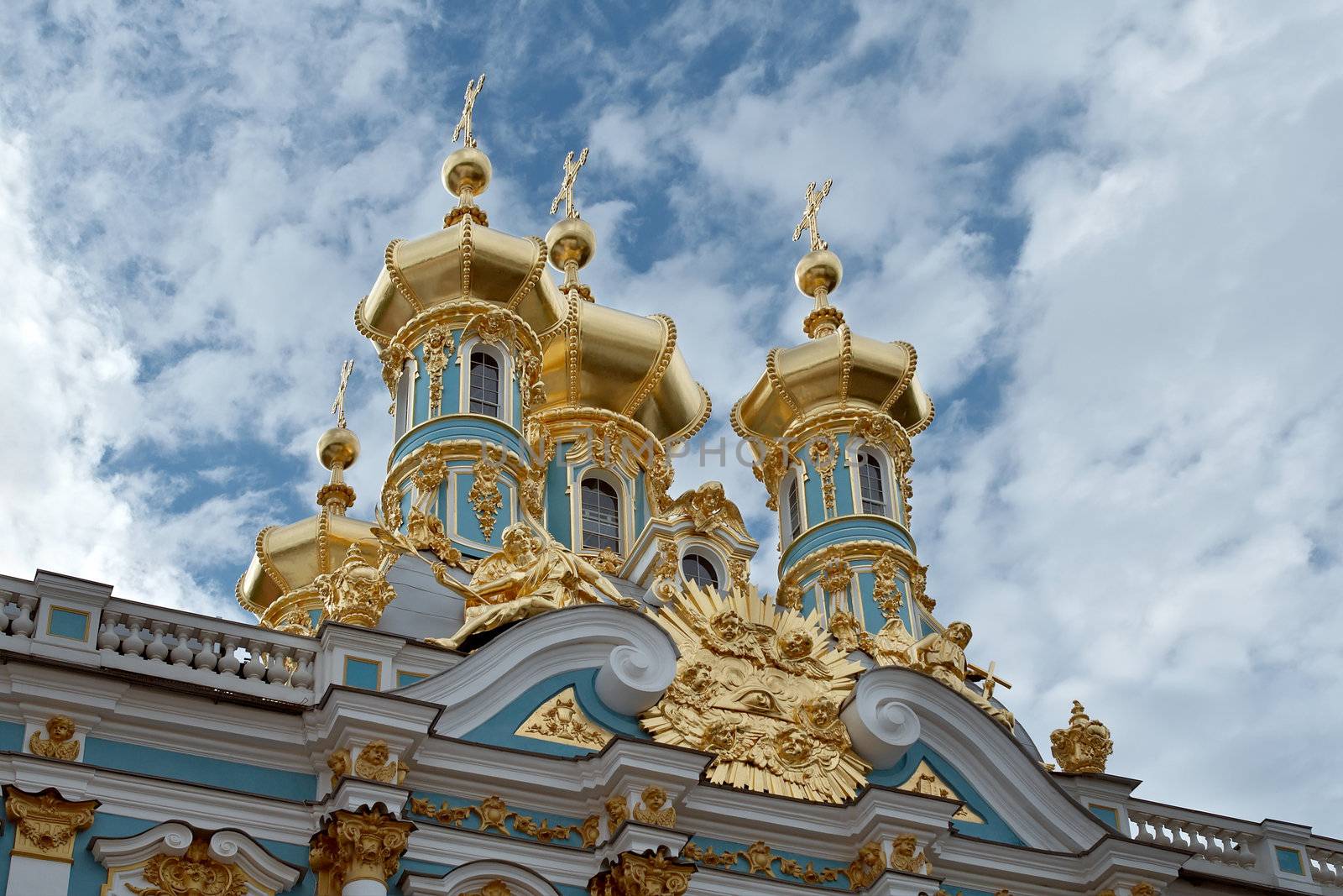 golden cupolas of Catherine Palace church on the sky background