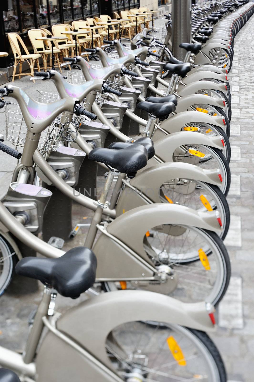 Group of bicycles on the sidewalk. Photo with tilt-shift lens