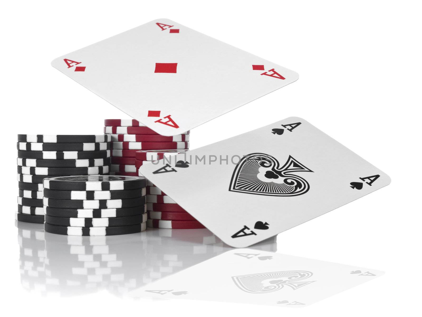 Two aces flying over piles of gambling chips. Isolated on white.