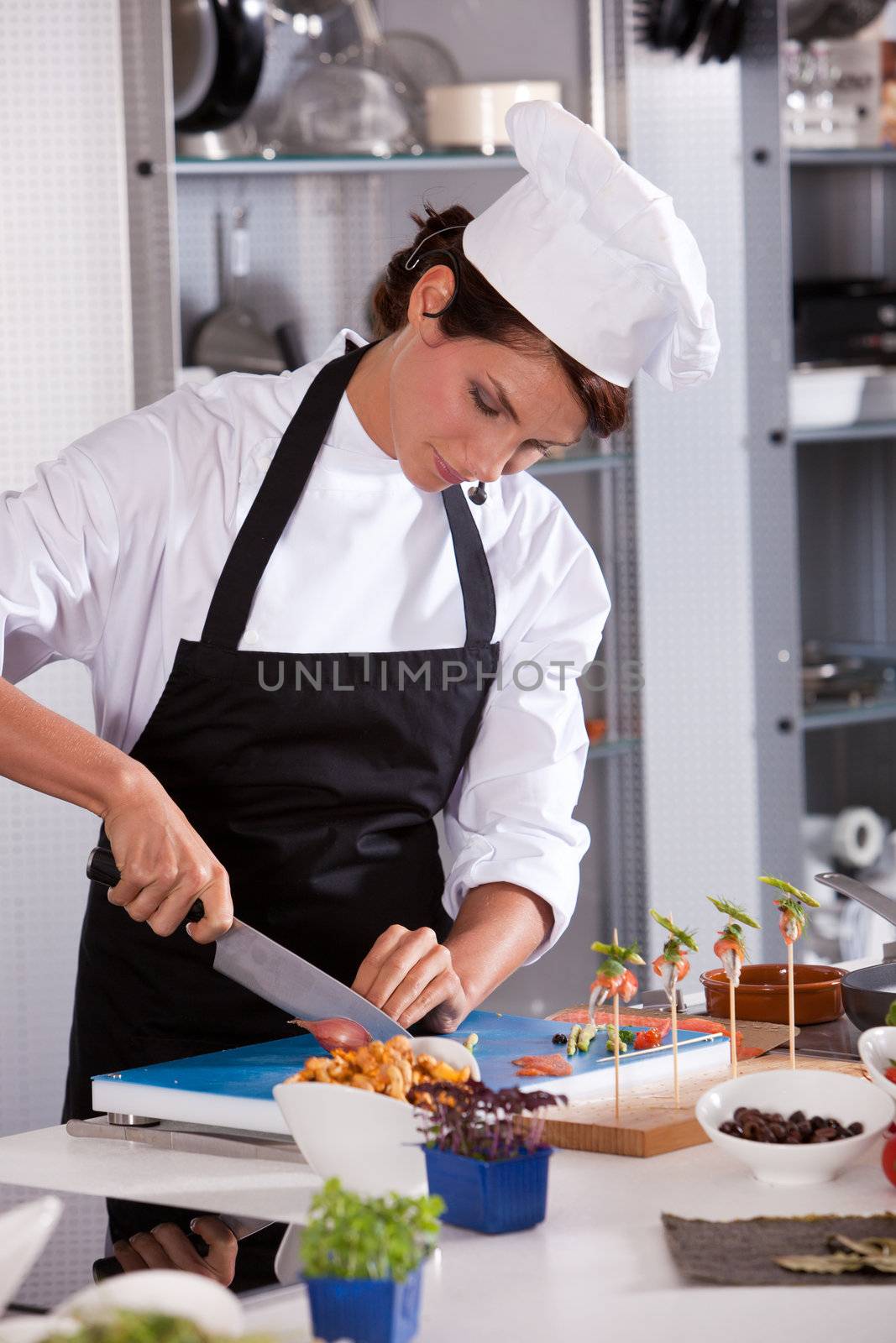 Female chef chopping the food