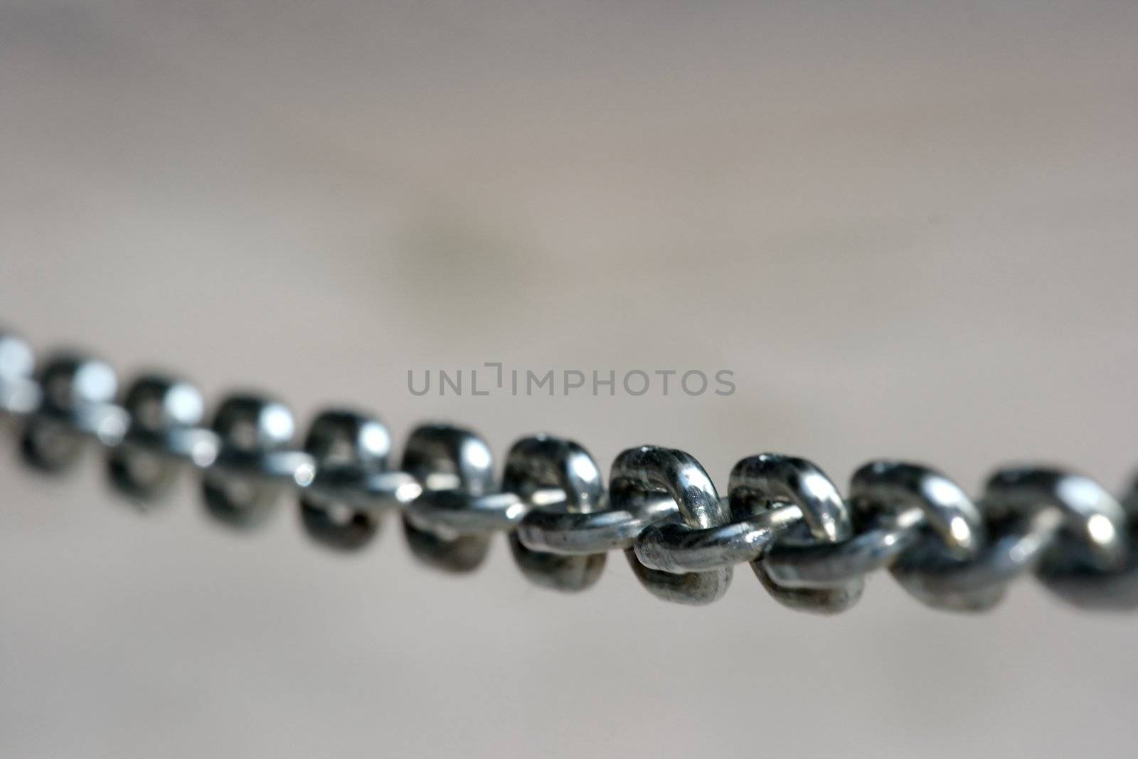 Closeup of a metal chain, only one part is in focus