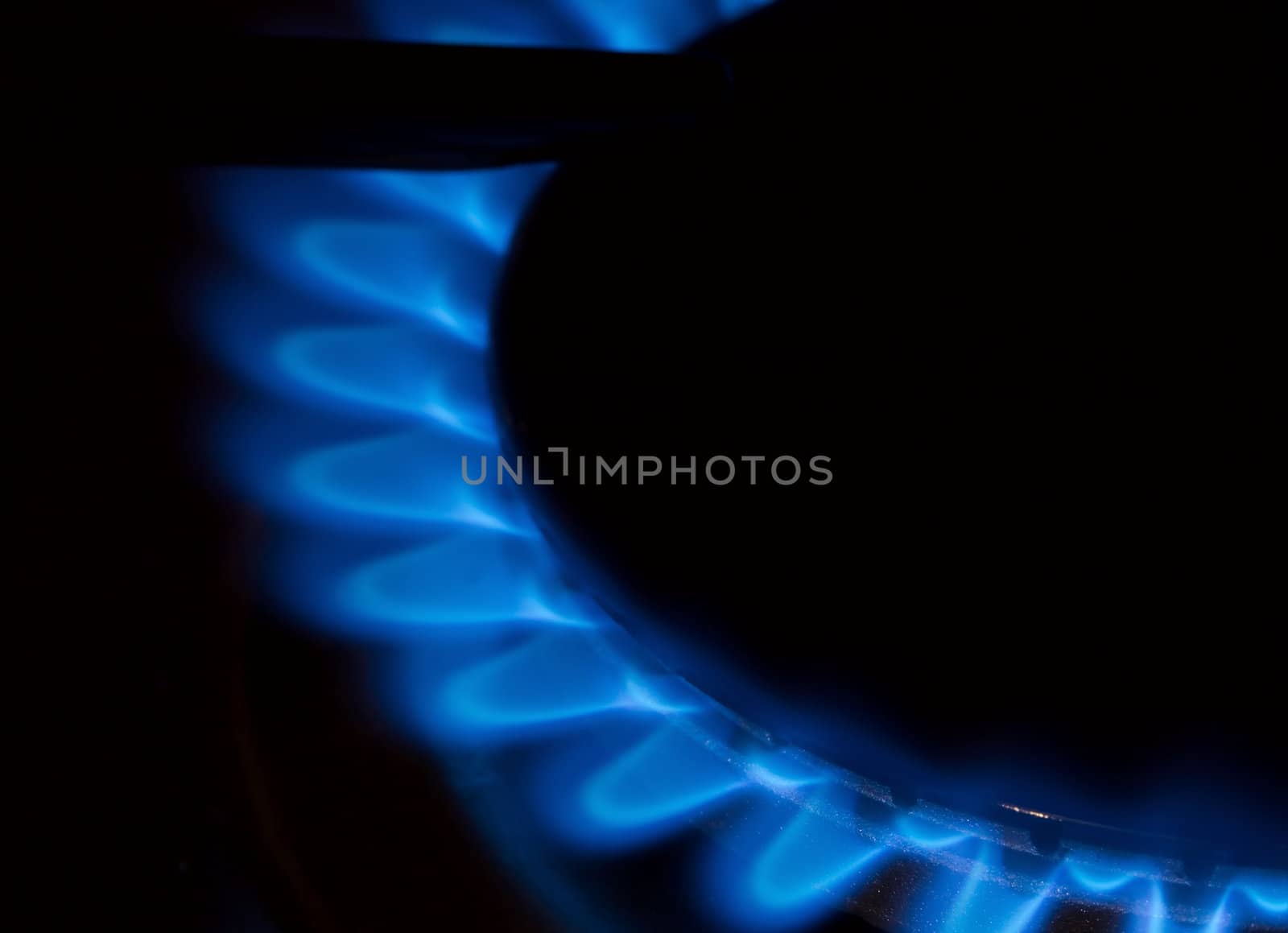 Gas flame of a stove in the dark