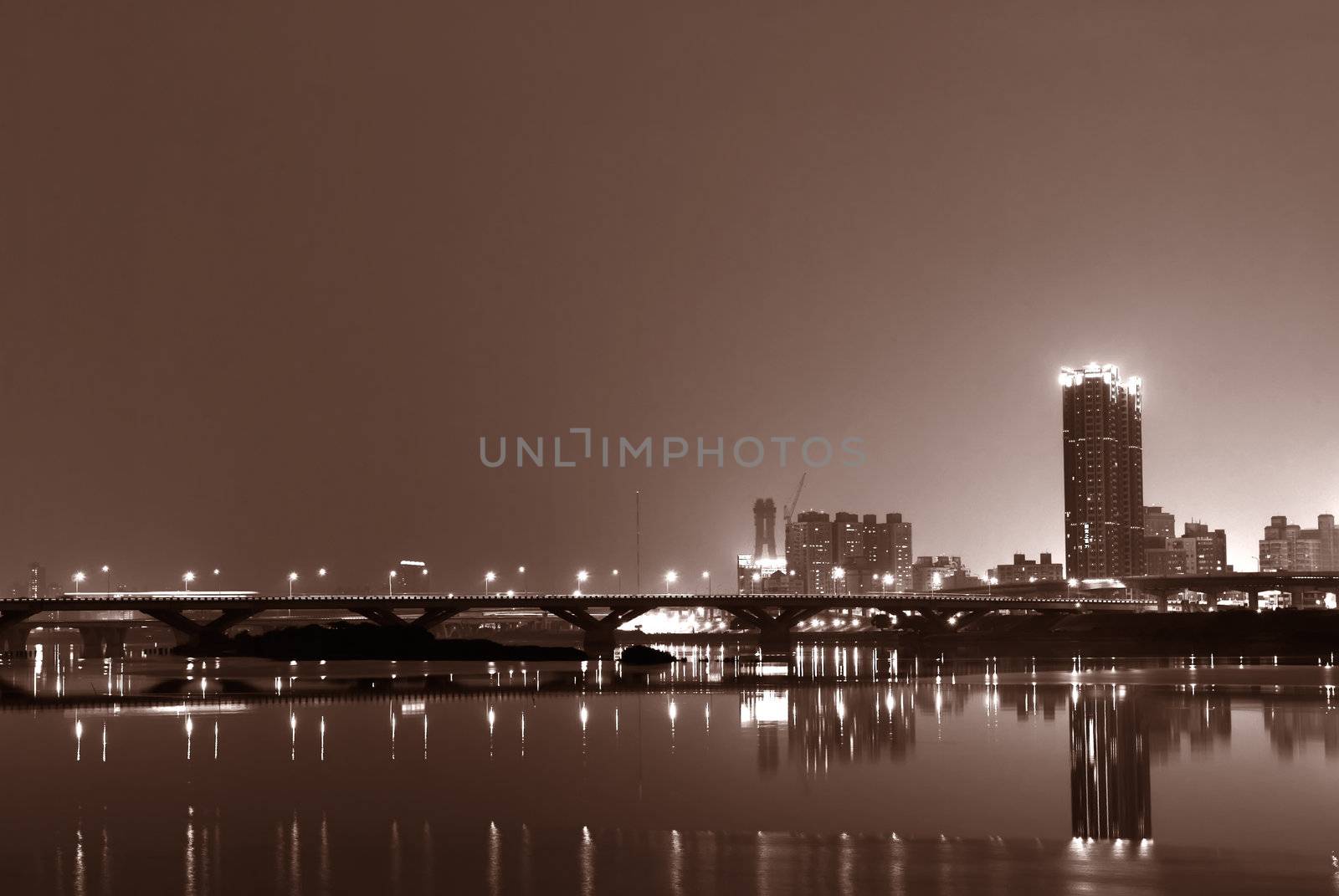 It is a lonely blue and purple city night.