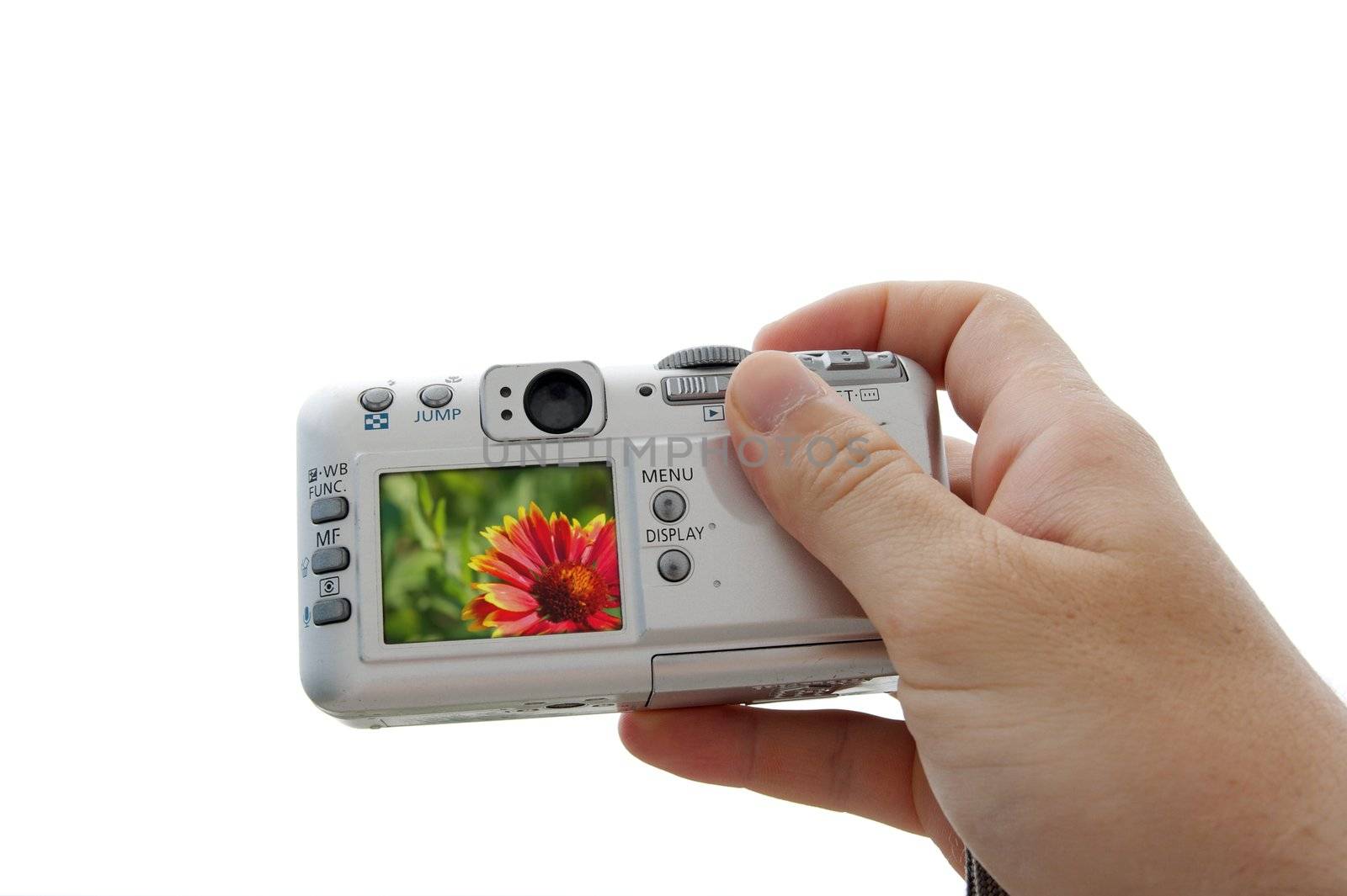 Digital camera in human hand isolated on white