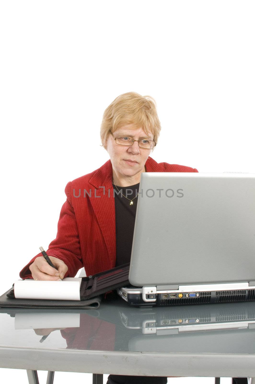 succesfull businesswoman is looking at her finance stats with a smile