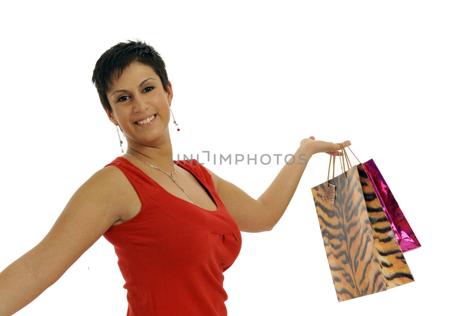 Half body view of young attractive woman doing shopping with lots of shopping bags. Isolated on white background.