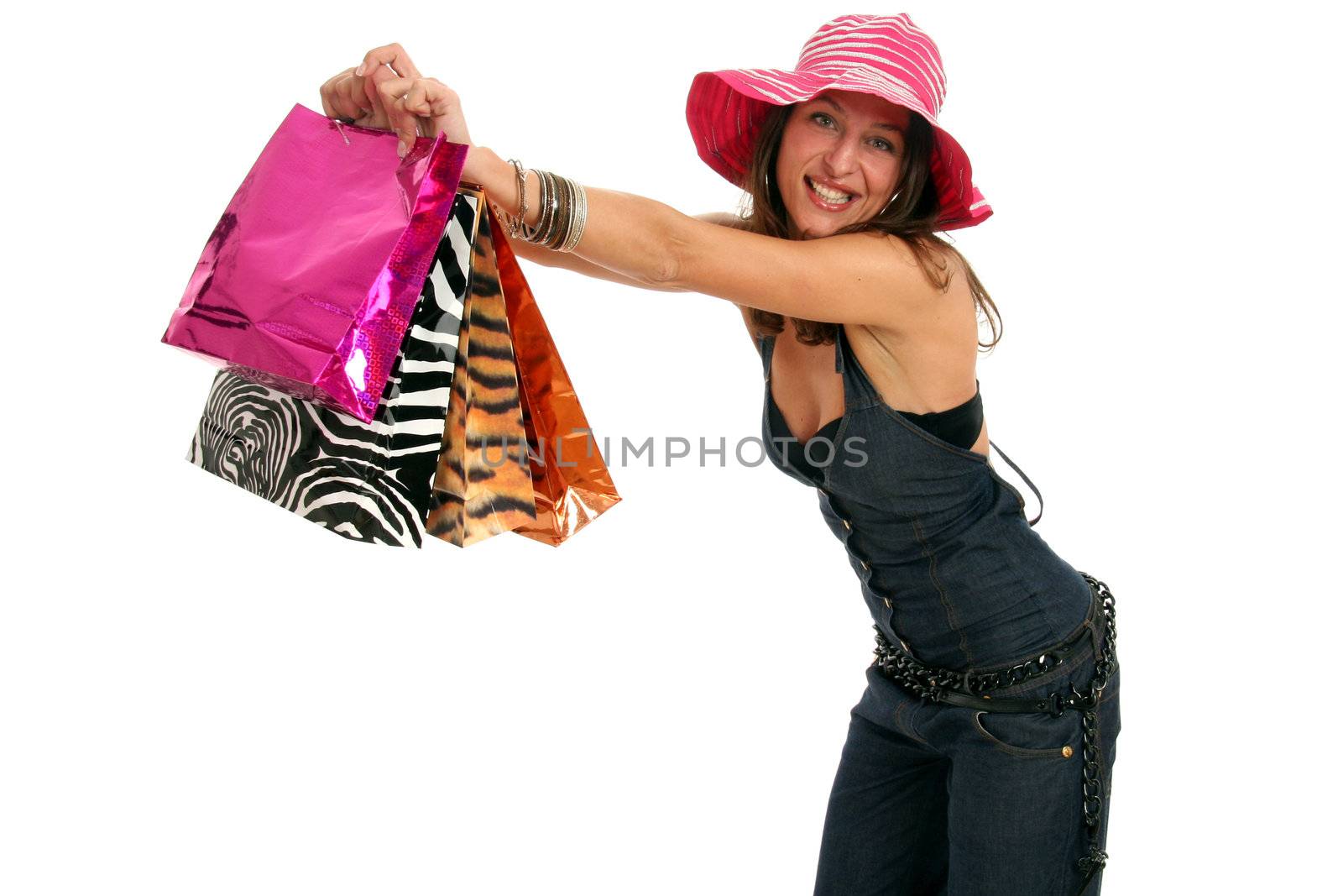 Half body view of young attractive woman doing shopping with lots of shopping bags. Isolated on white background.