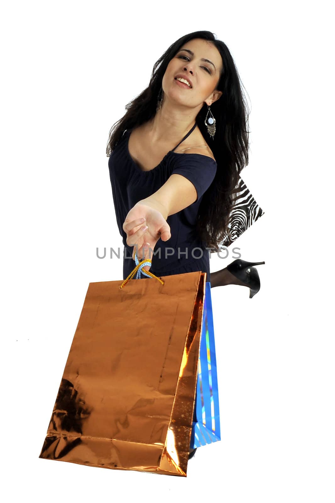 Full body view of young attractive woman in elegant wear,  going shopping with lots of colorful shopping bags. Isolated on white background.