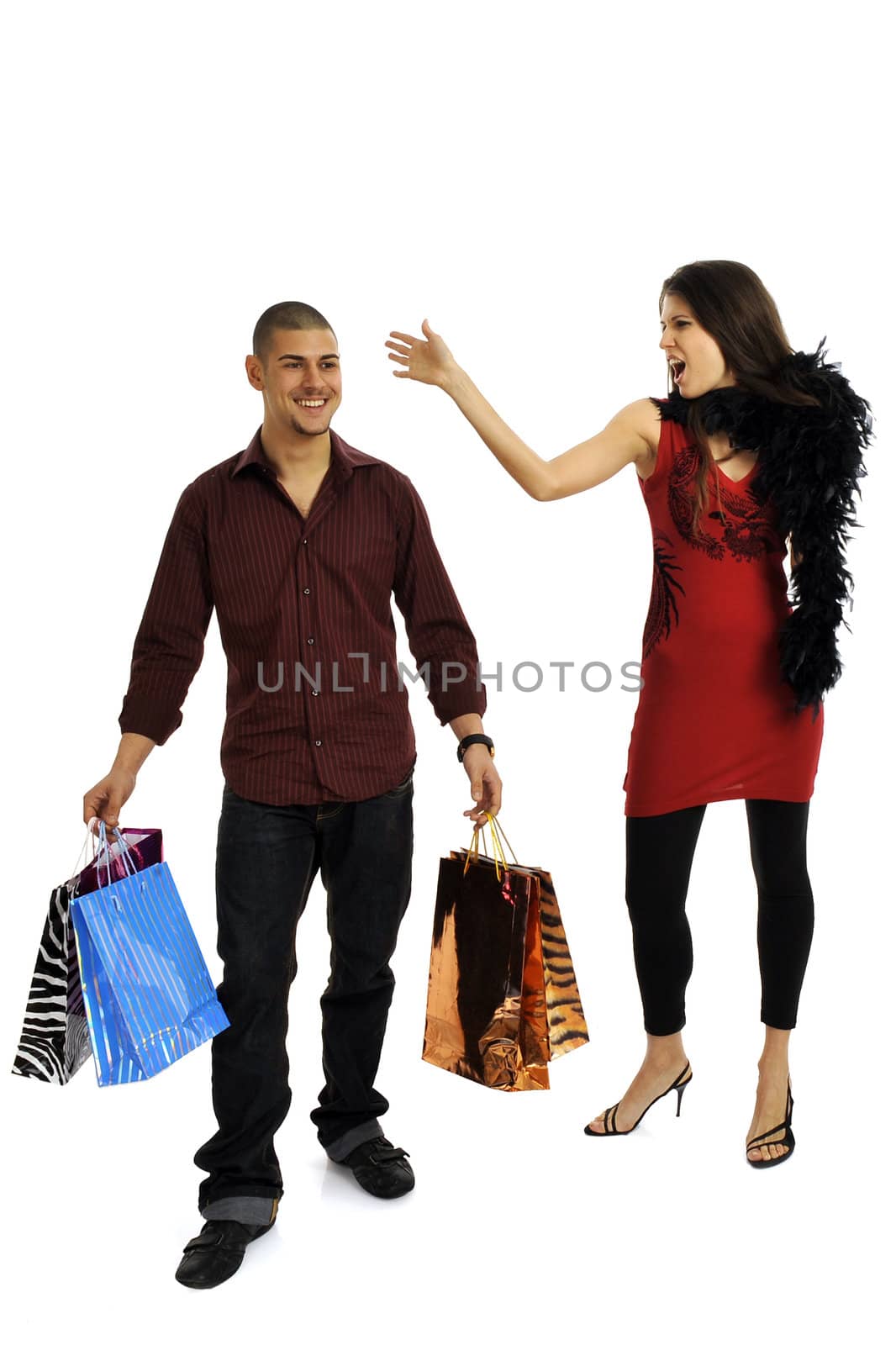 Full body view of young attractive woman and man in elegant wear, going shopping with lots of colorful shopping bags. Isolated on white background.