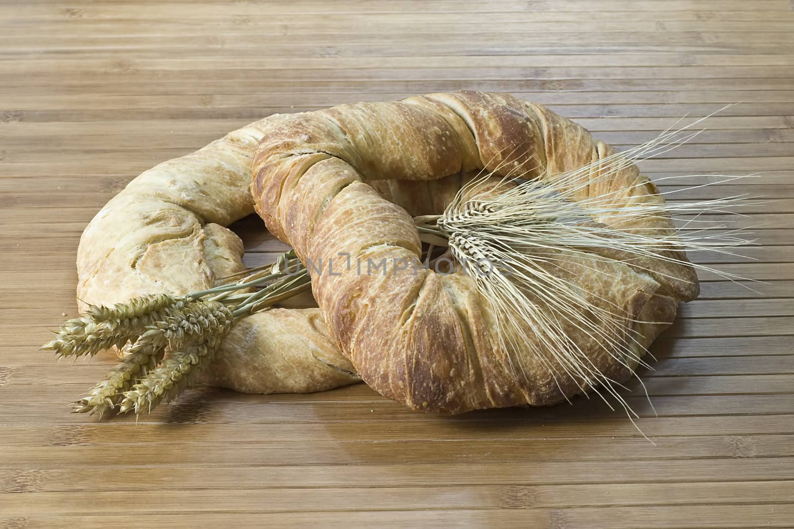 Some types of bread on a bamboo background.