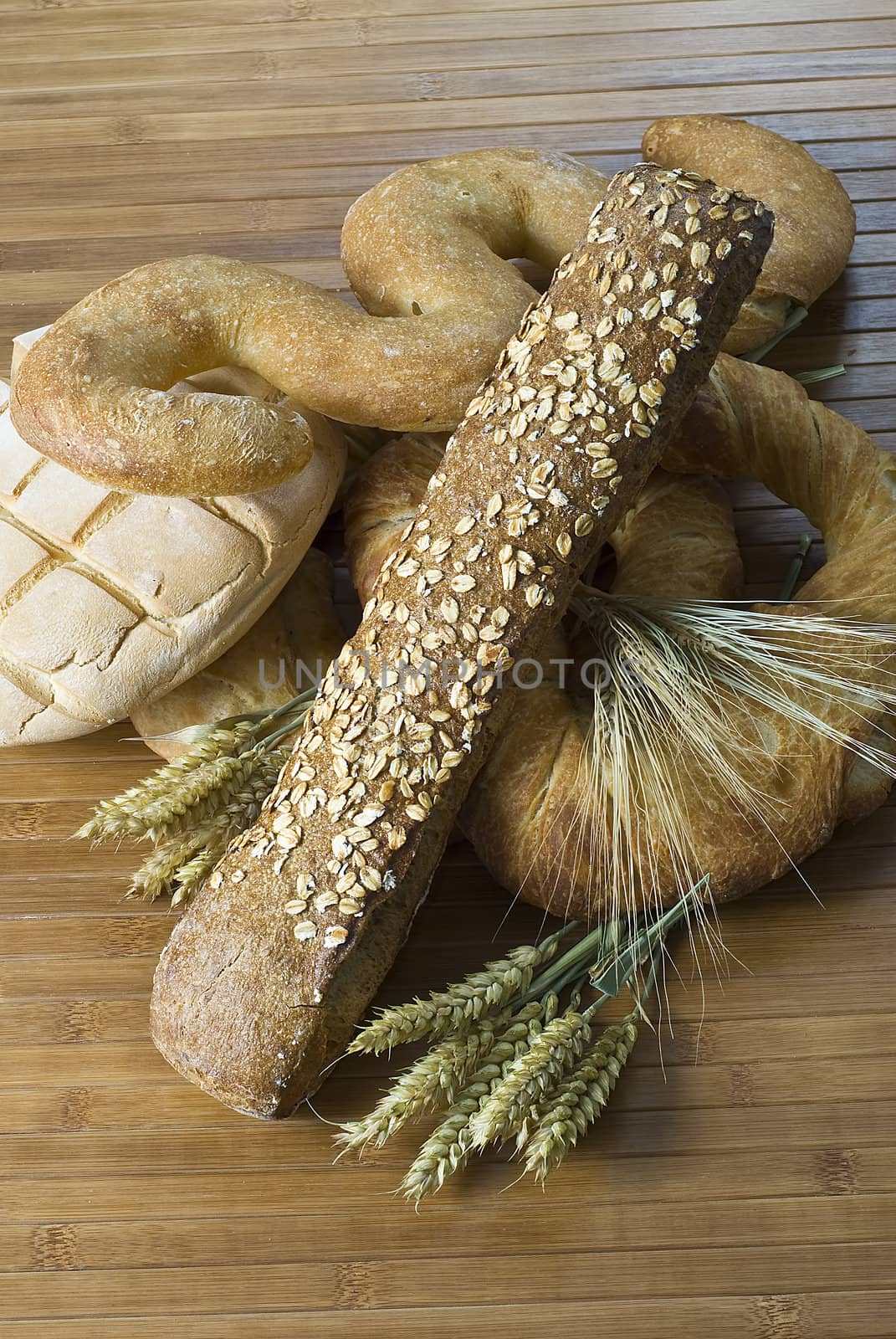 Some types of bread on a bamboo background.