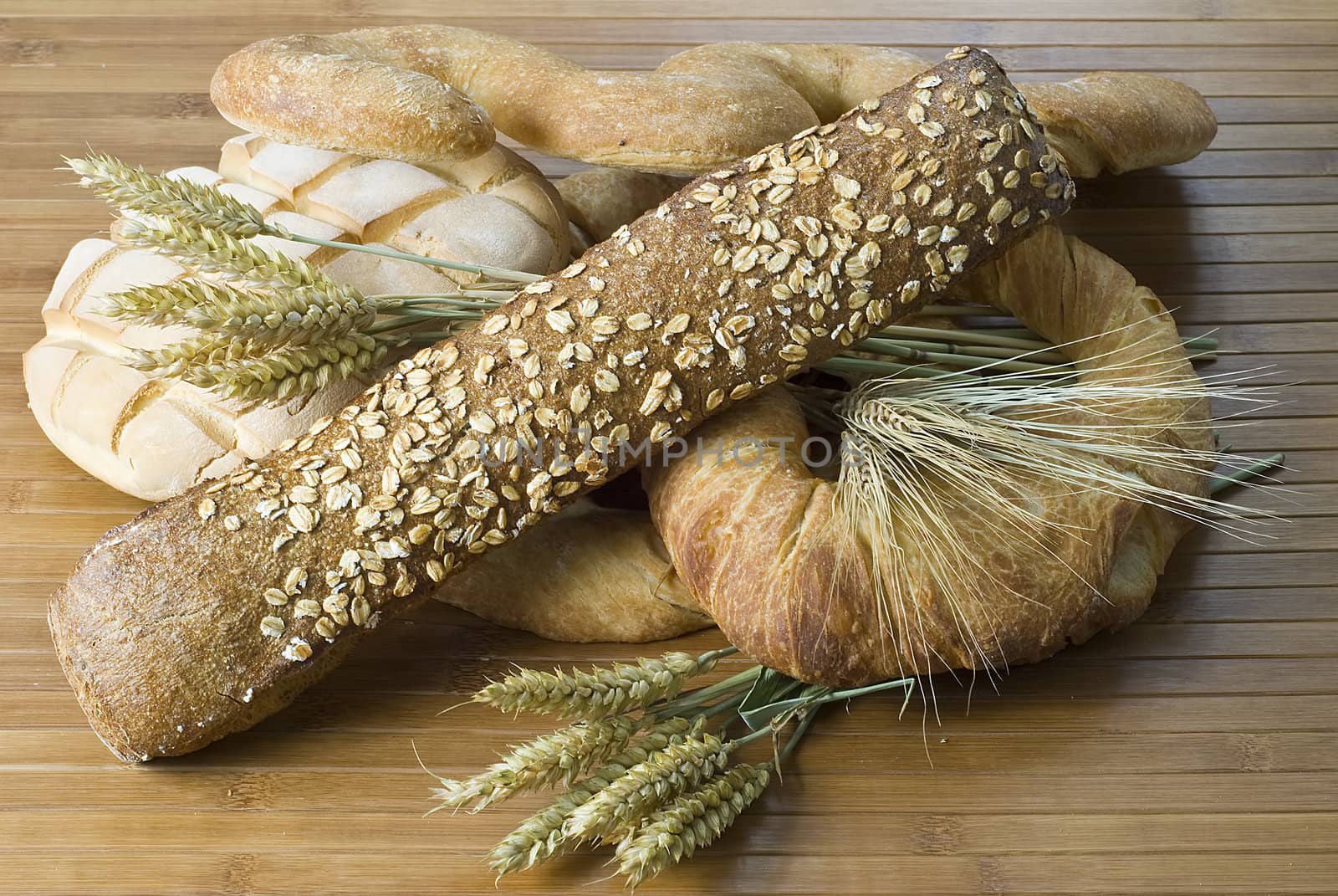 Some types of bread on a bamboo background.