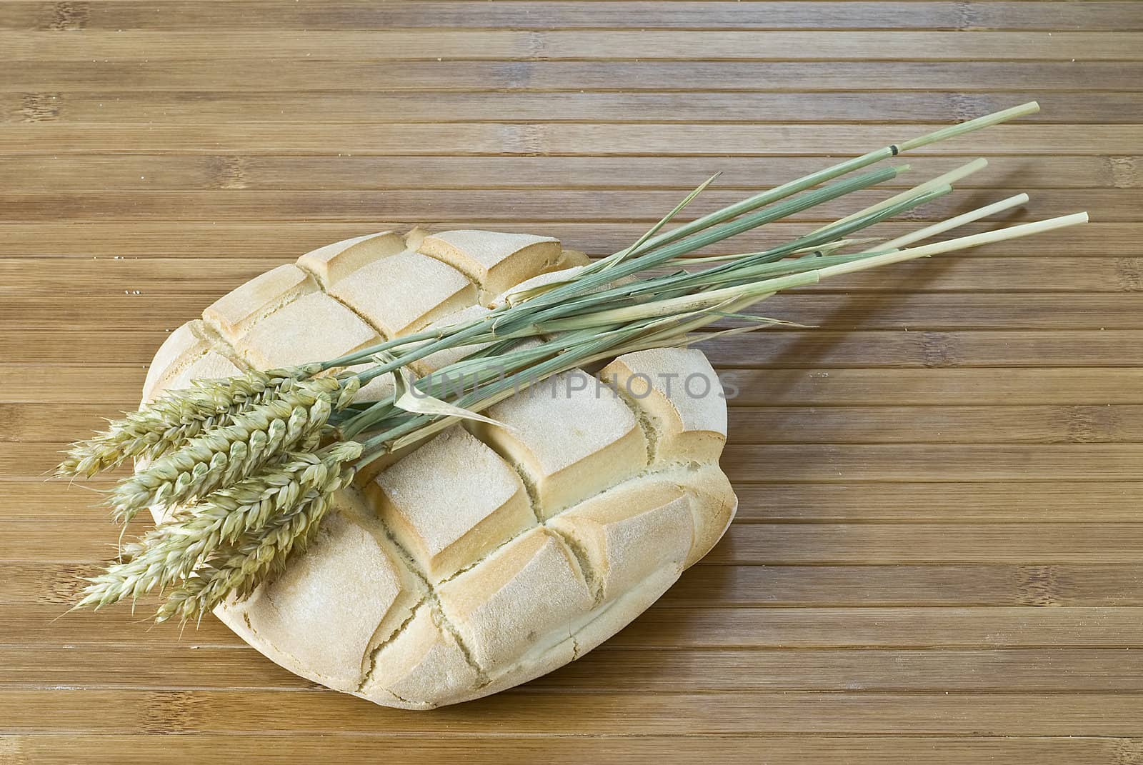 Some types of bread on a bamboo background.