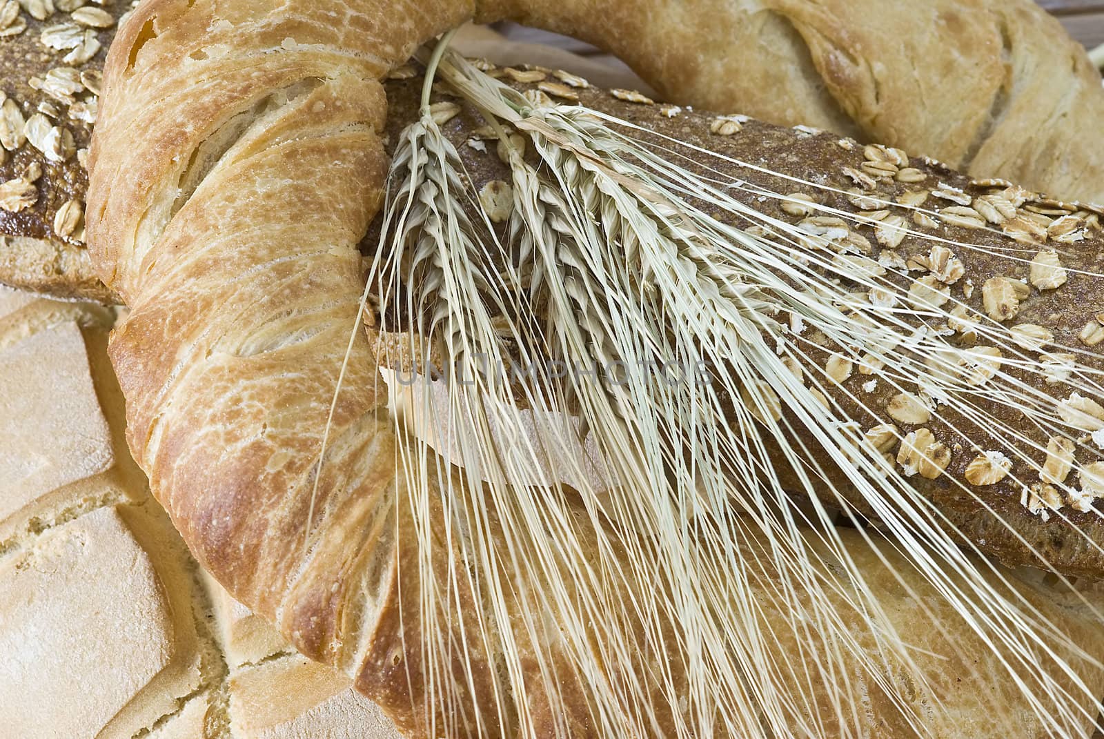 Some types of bread on a bamboo background.