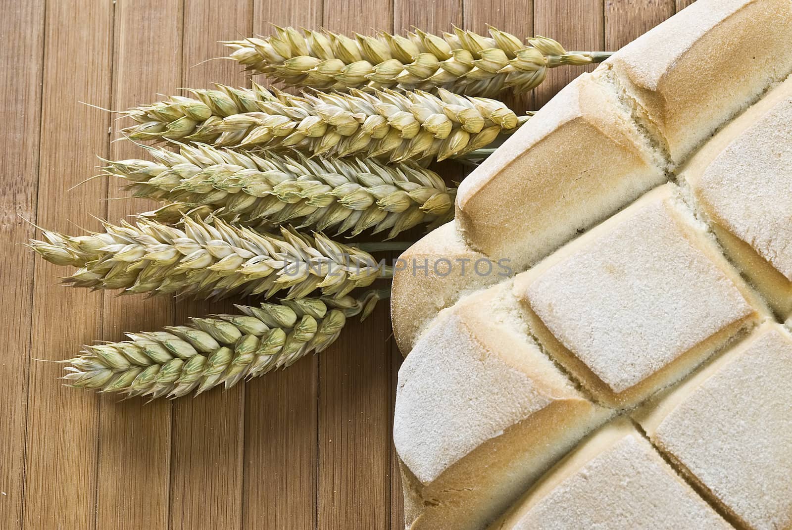 Some types of bread on a bamboo background.