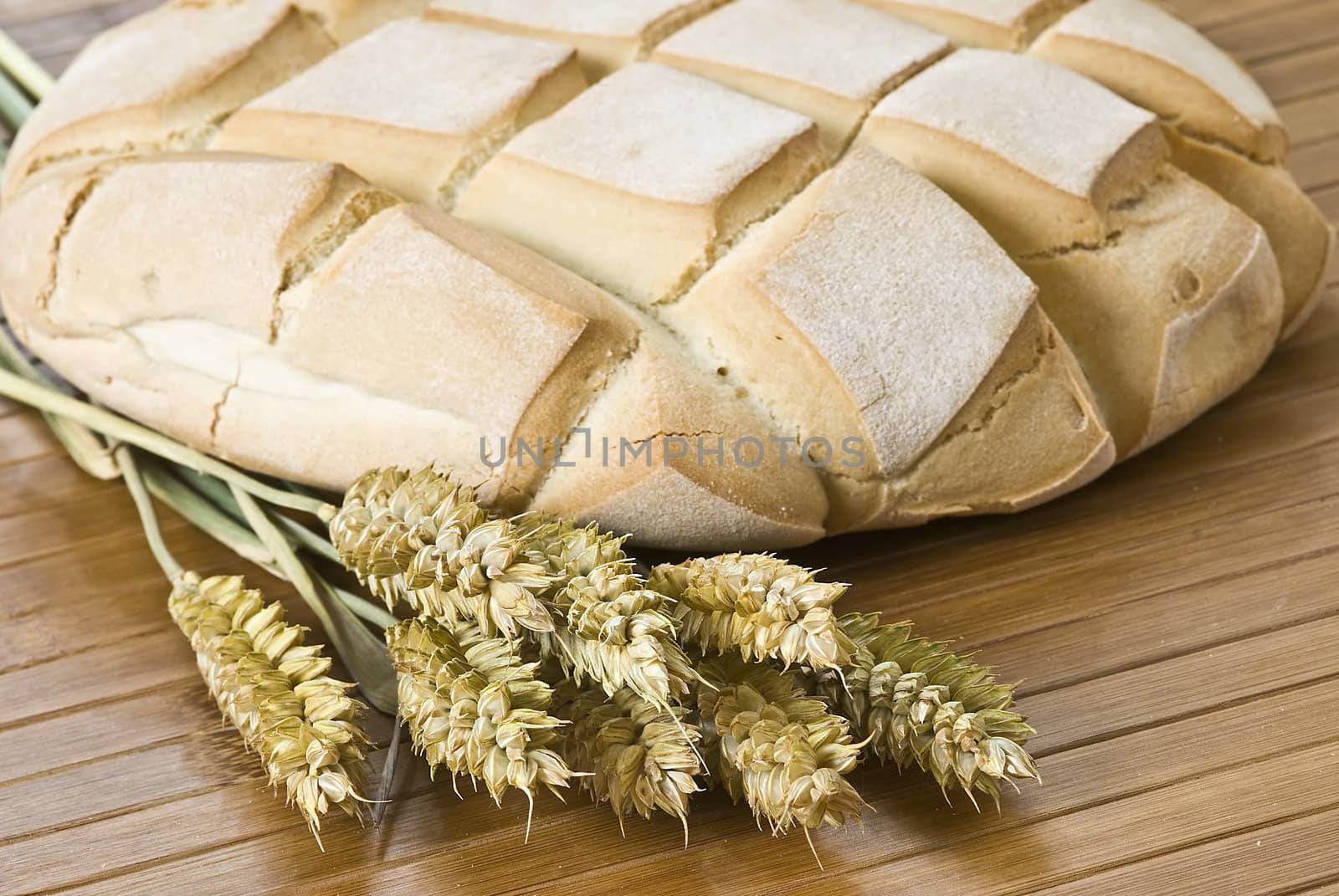 Some types of bread on a bamboo background.