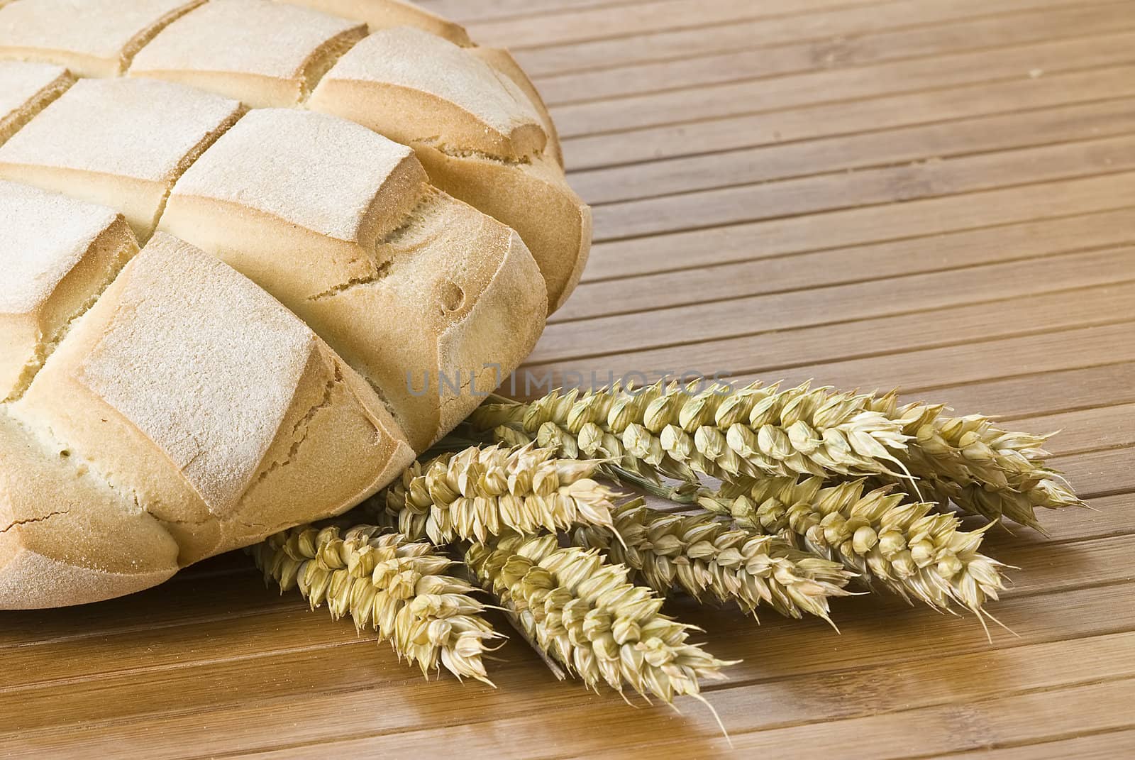 Some types of bread on a bamboo background.