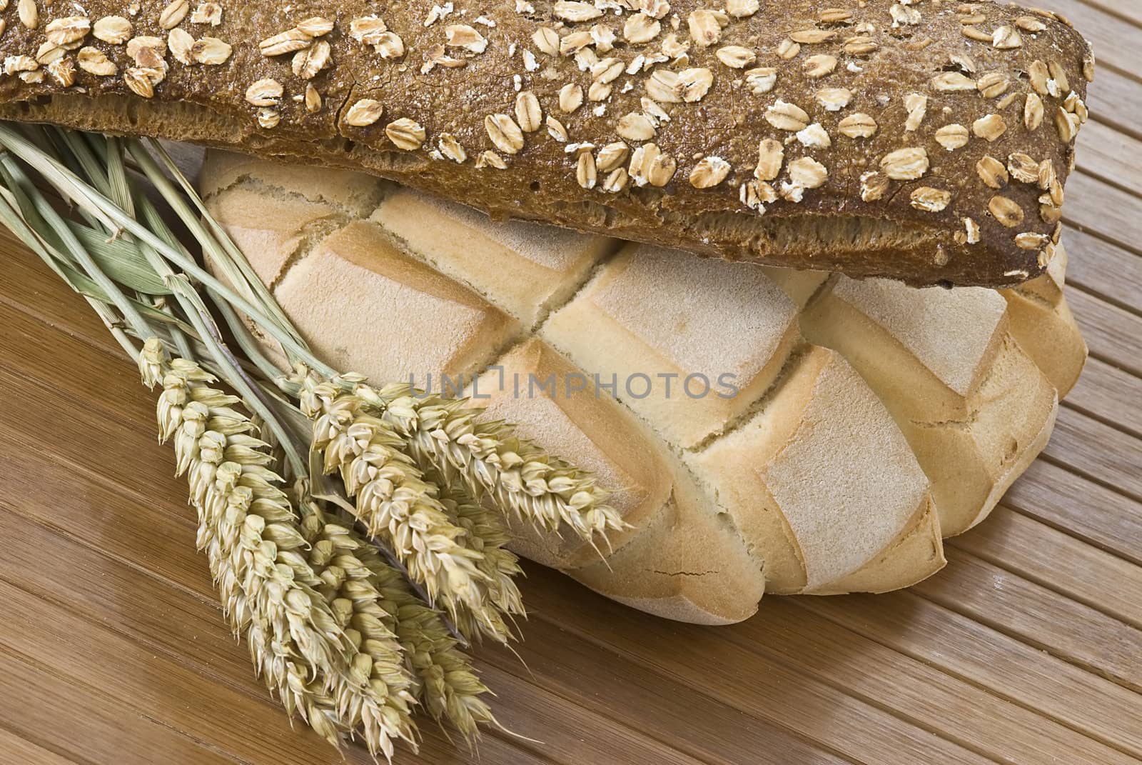 Some types of bread on a bamboo background.