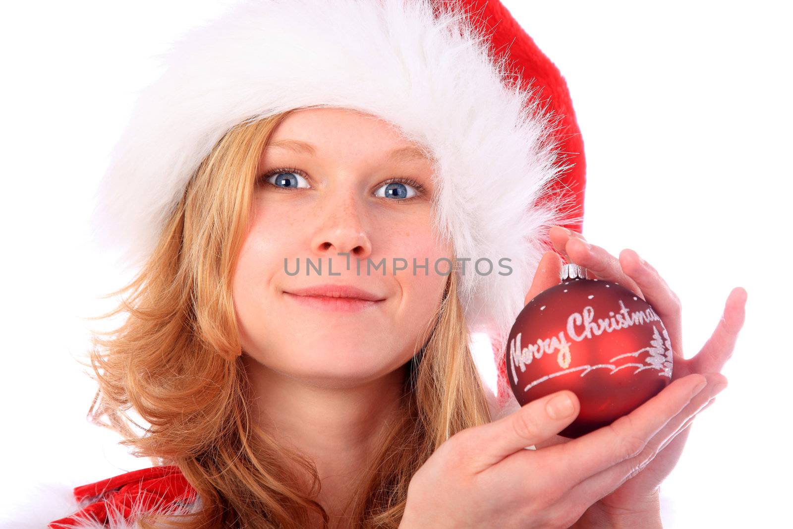 Miss Santa is smiling with wide open eyes and holding a red christmas tree ball - "Merry Christmas" is written on the ball