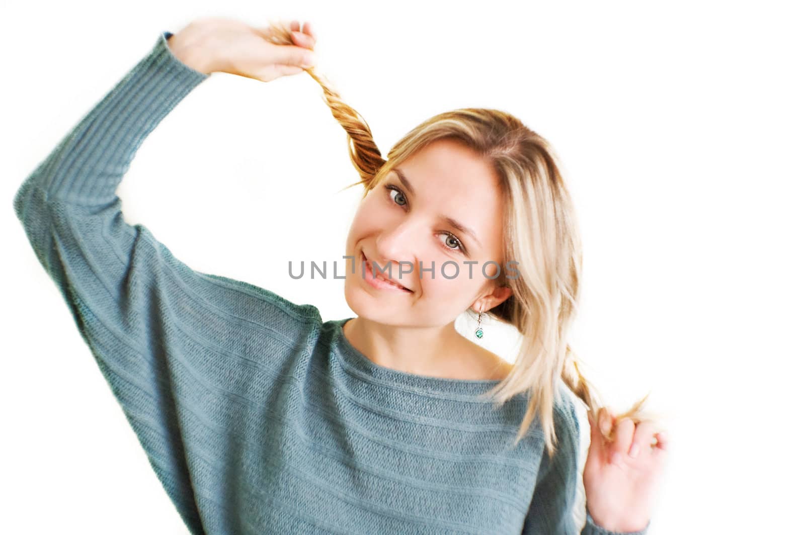 Joyful funny girl with two plaits over white