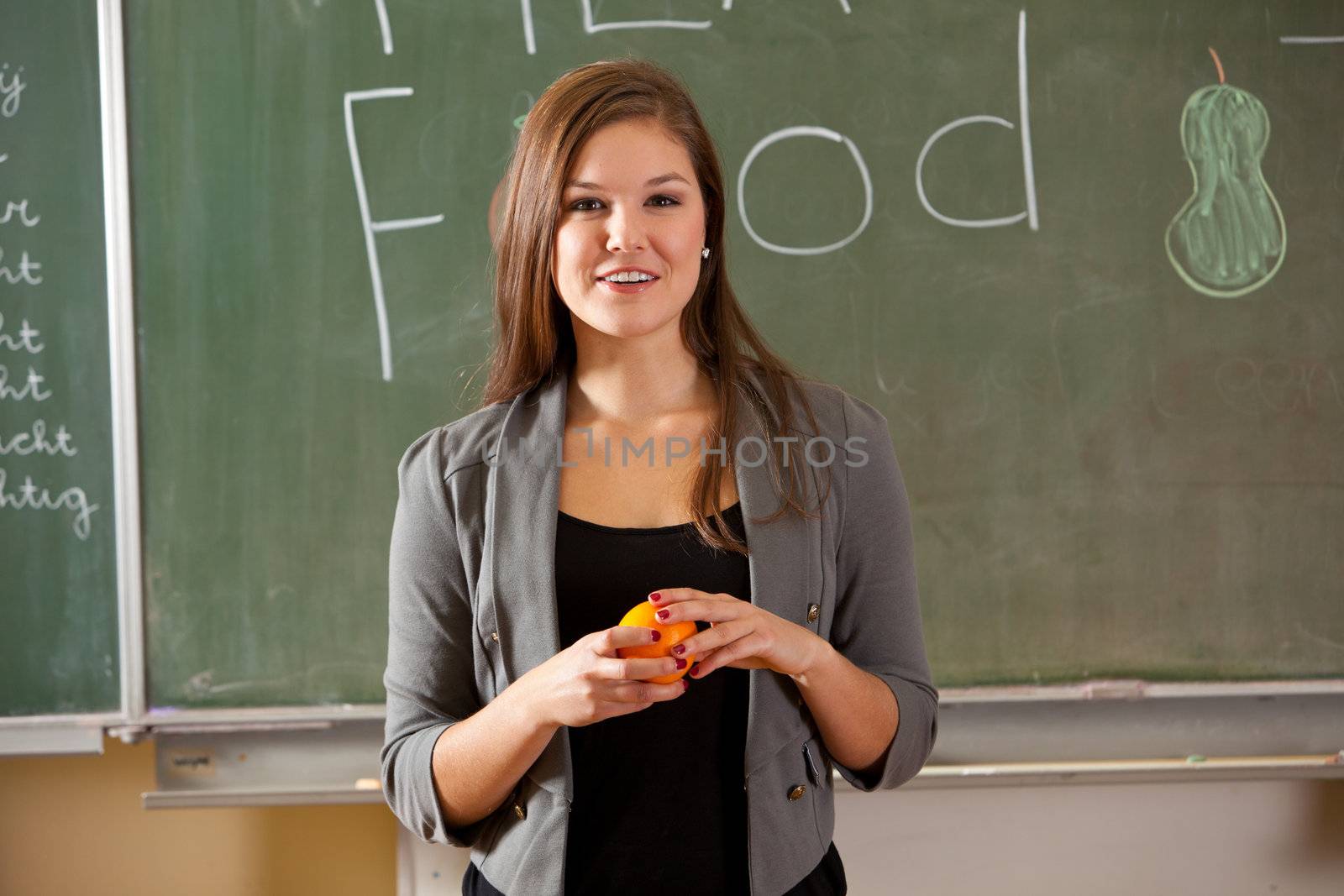 Teenager in the classroom giving a presentation on healthy food