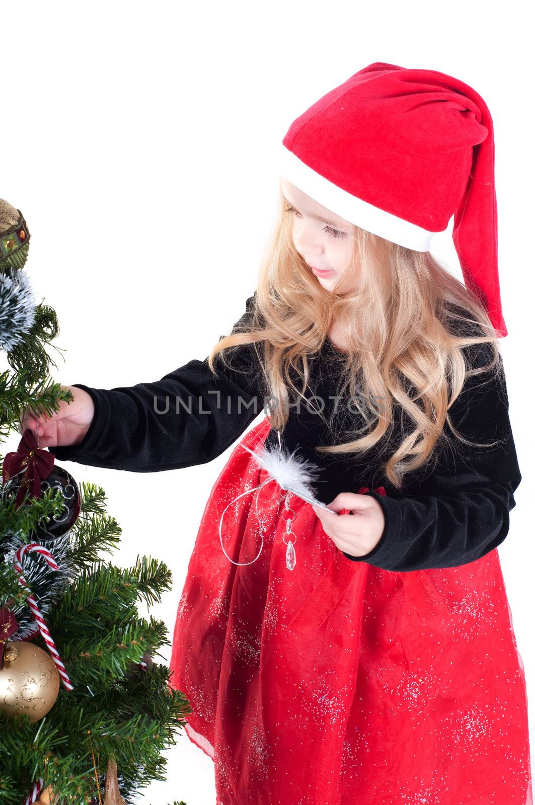 Beautiful baby girl dressed up for Christmas isolated in white