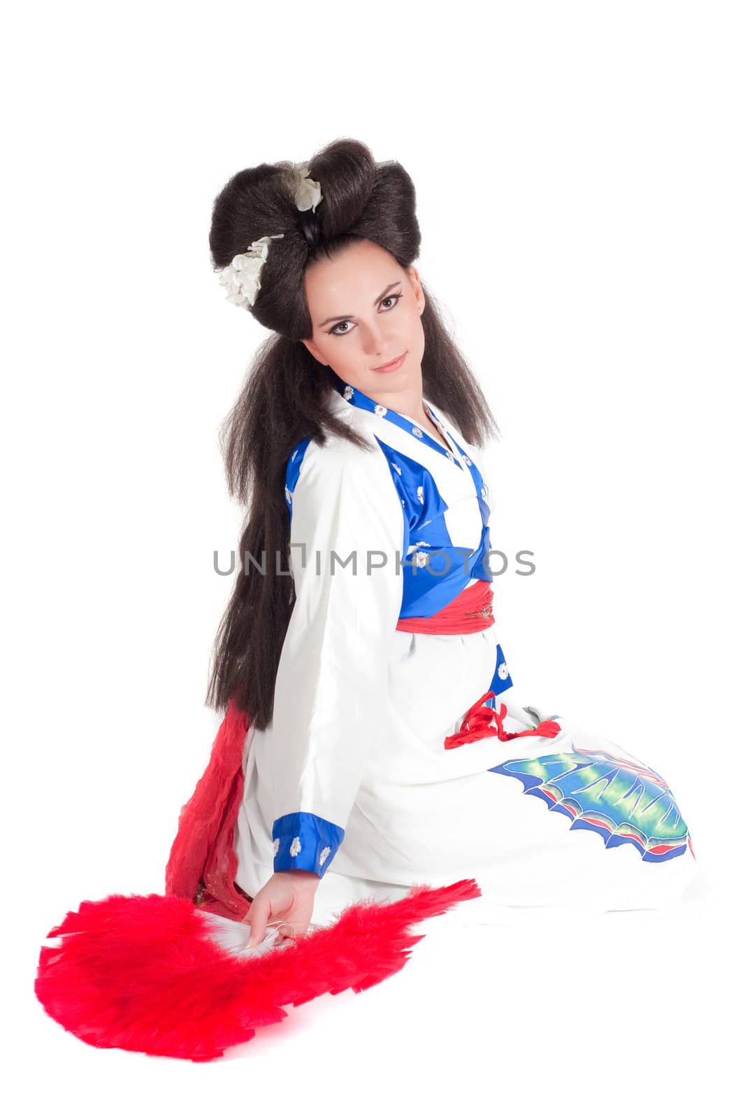 Portrait of the girl of the Asian appearance with a make-up under the geisha on a white background