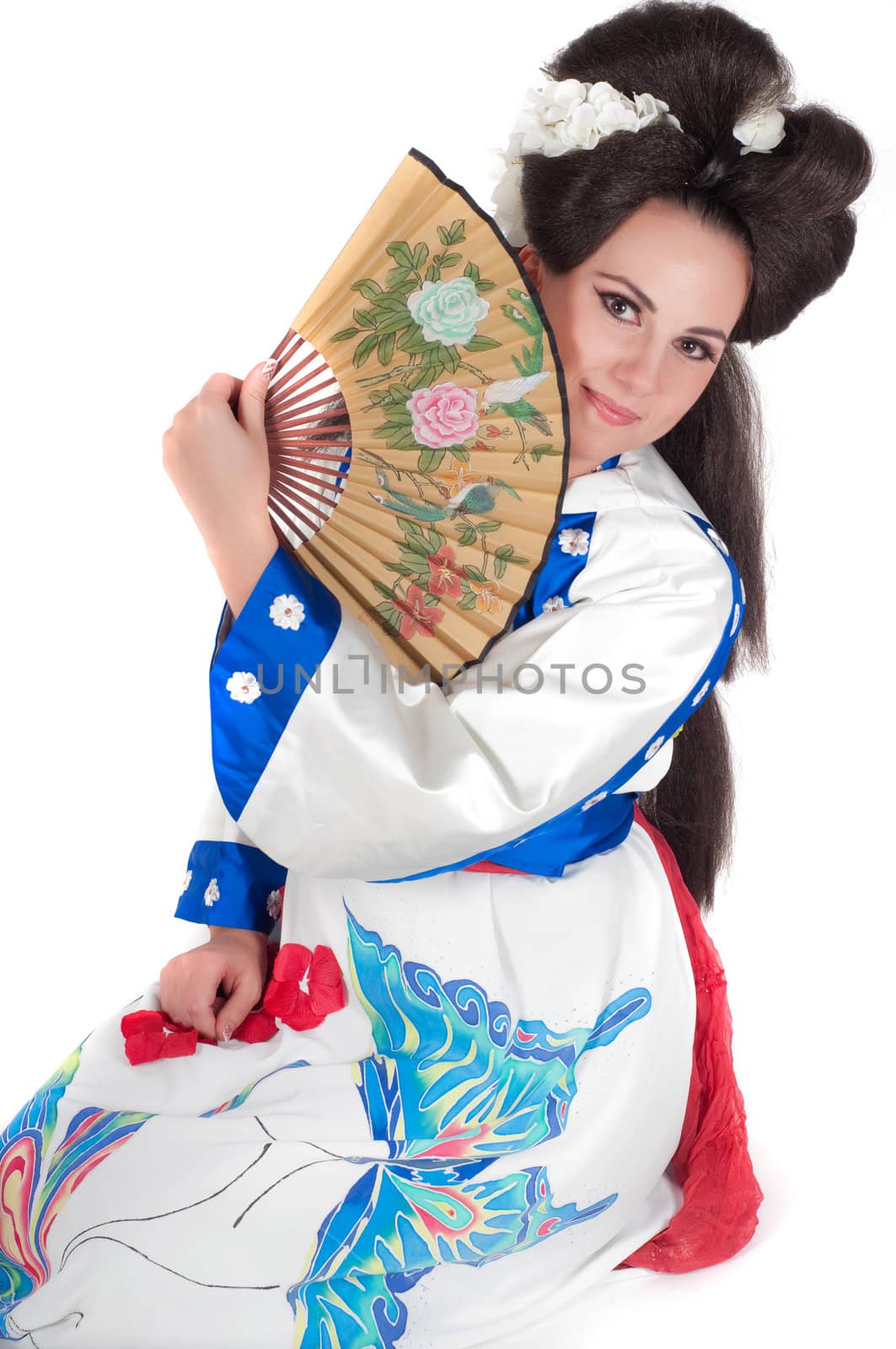 Portrait of the girl of the Asian appearance with a make-up under the geisha on a white background