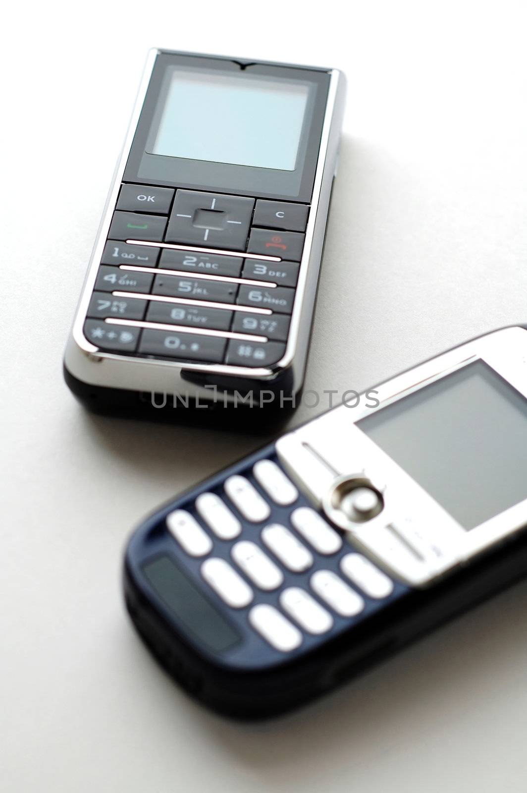 Two modern mobile phones side by side