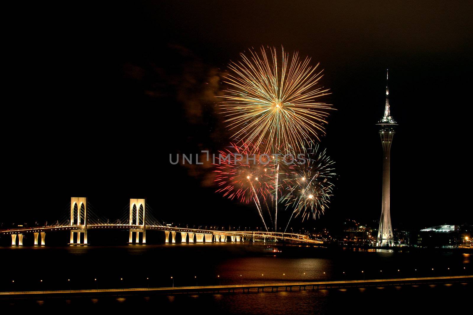 Celebration of New Year in Macau with fireworks beside the Tower Convention and Sai Van bridge