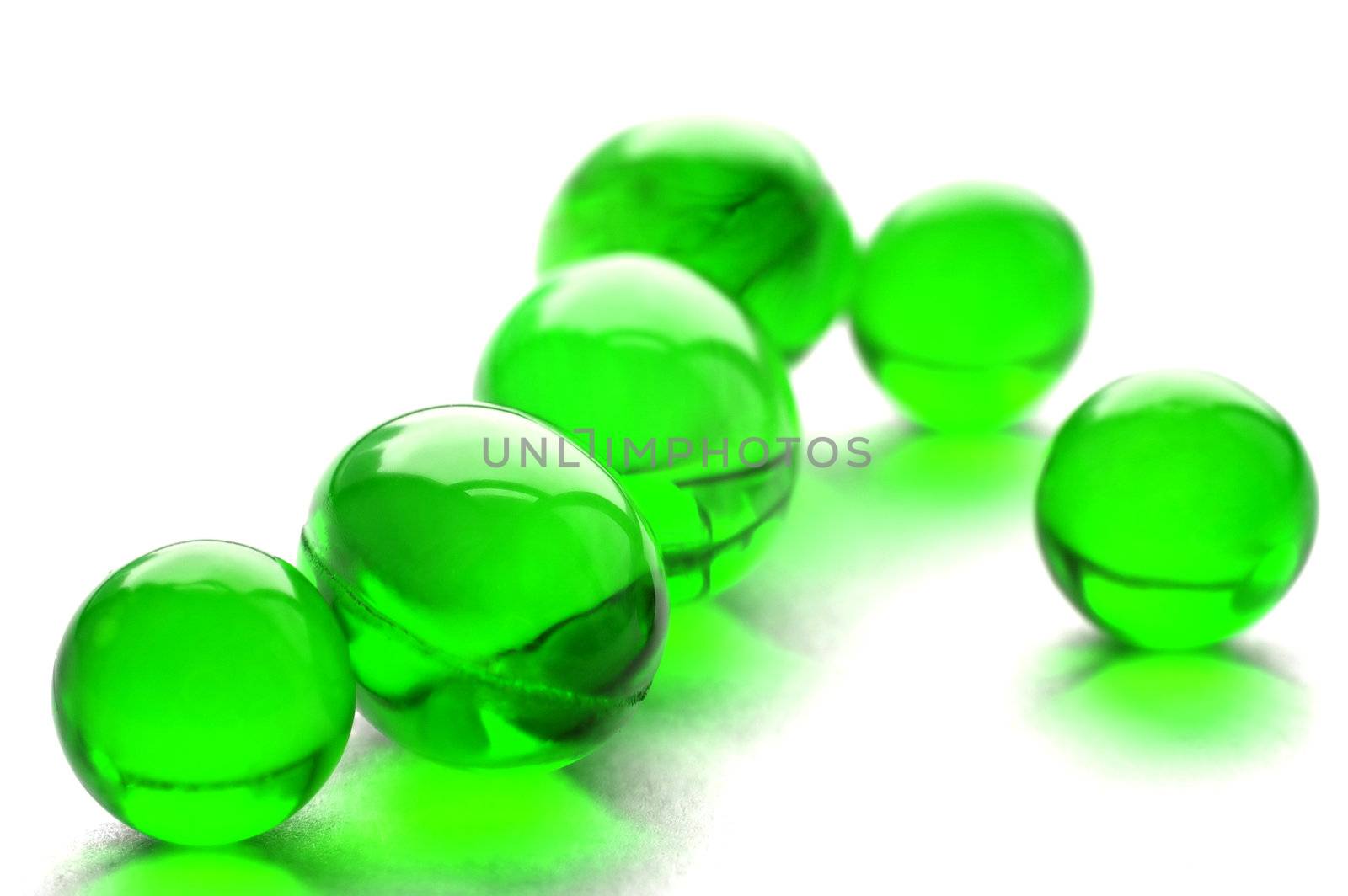An abstract picture of vitamins pills in green color