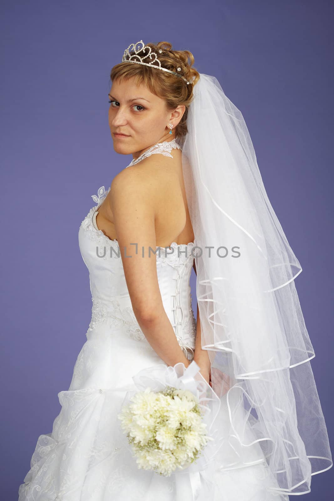 Portrait of a bride with a bouquet of flowers