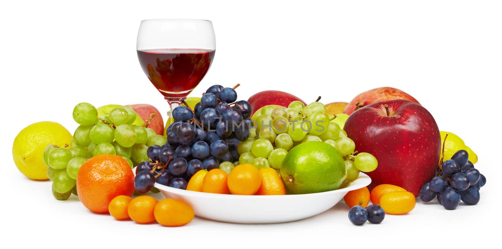The big still-life with fruit and a wine glass on a white background