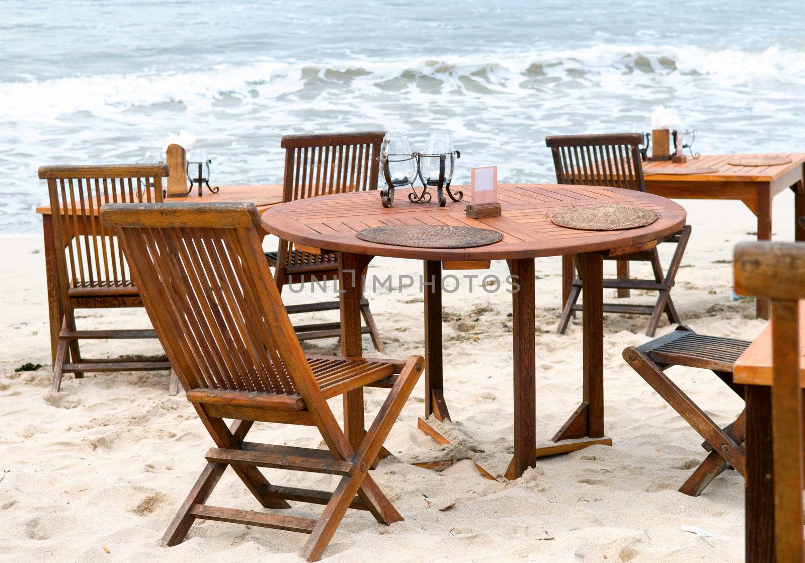 Table set of open-air restaurant, on beach