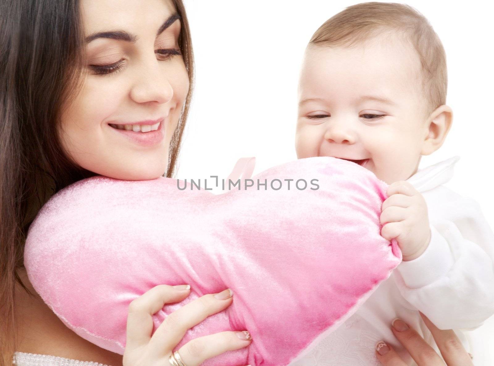 happy baby and mama with heart-shaped pillow