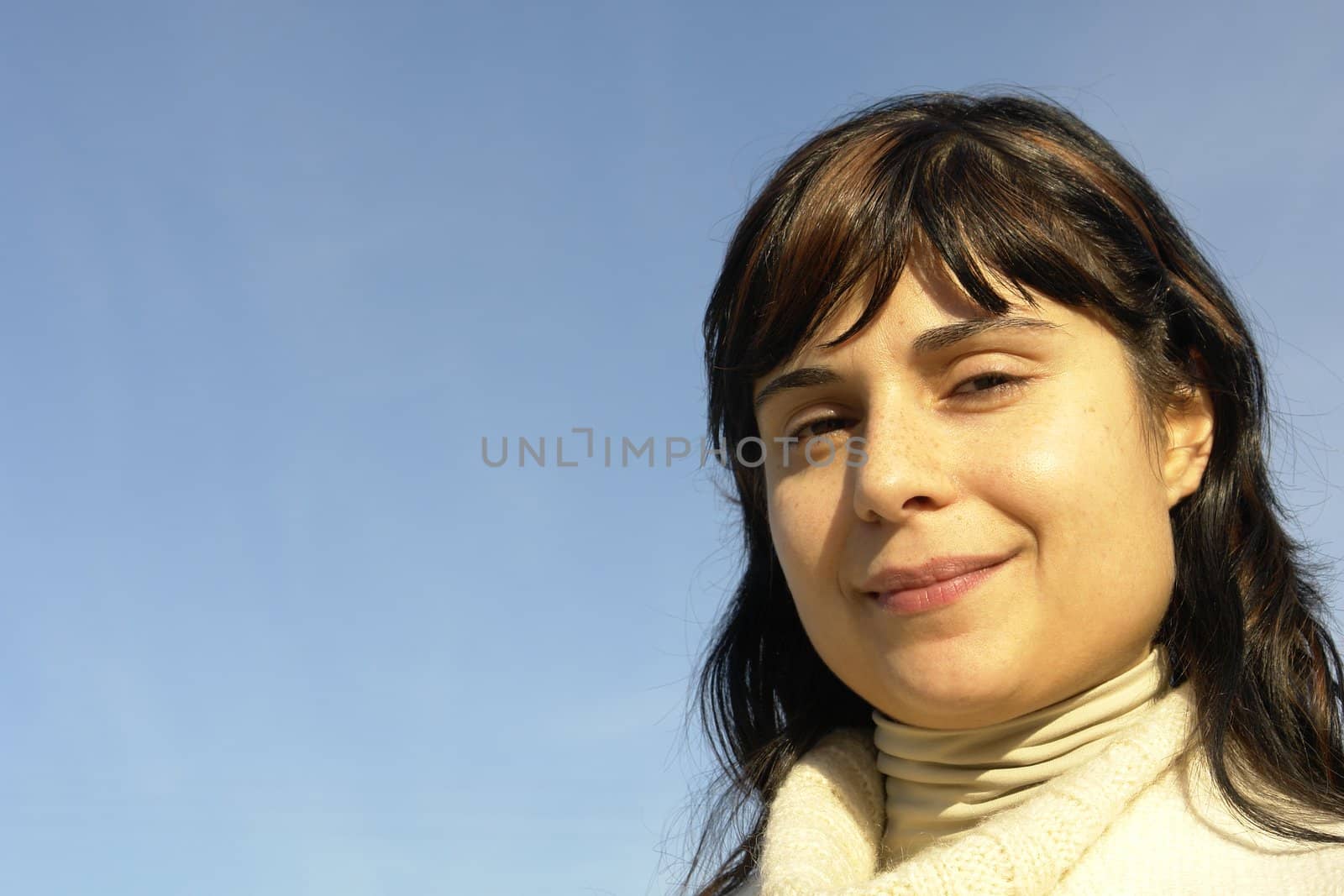 woman portrait with the sky as background