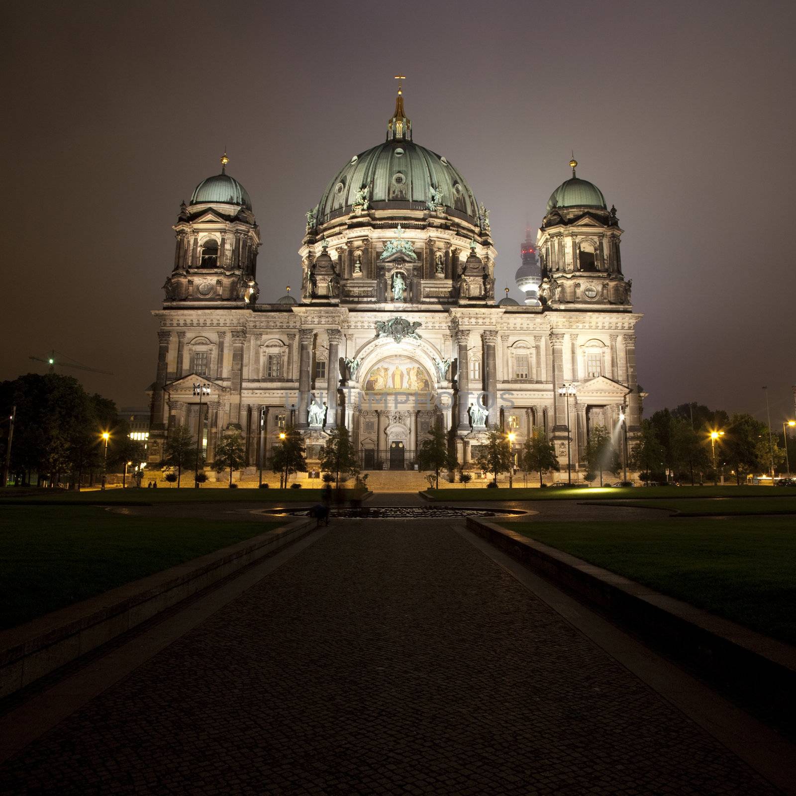 A view of the Berliner Dom and the TV Tower in the distance.  At night in Berlin.