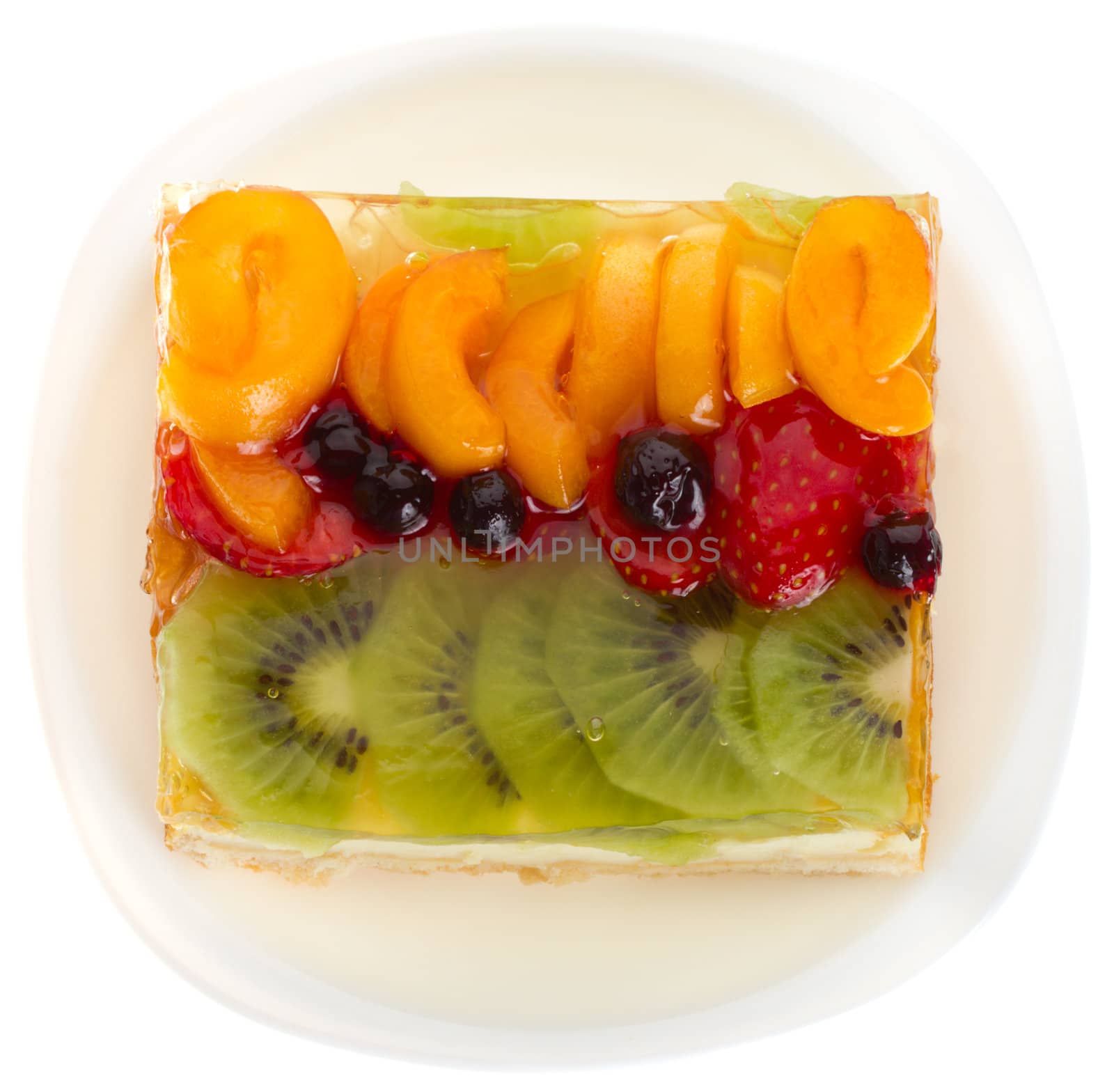 close-up curd cake with jellied fruits and berries, isolated on white