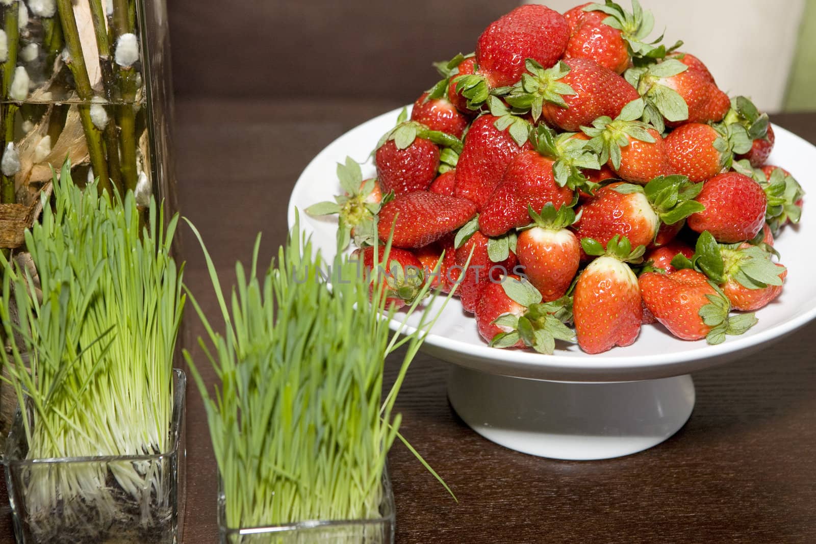 strawberries  in vase on table 