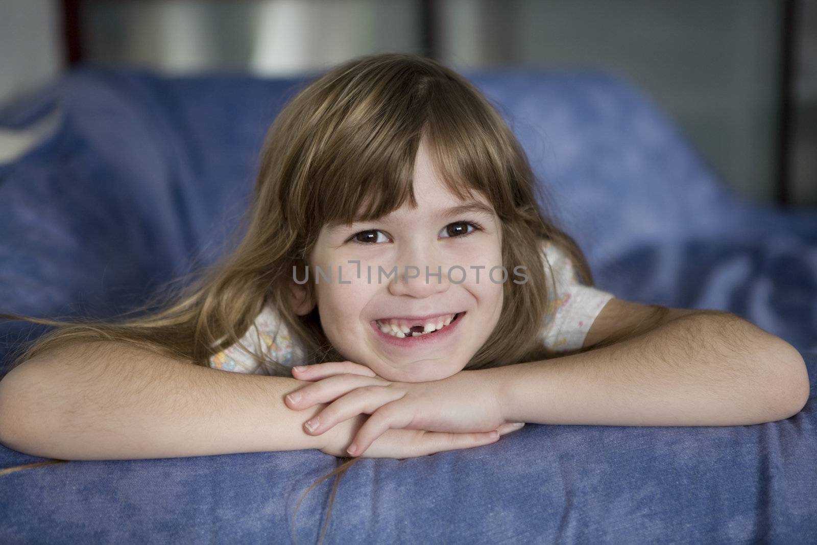 closeup portrait toothless cute smiling seven year girl with lon by elenarostunova