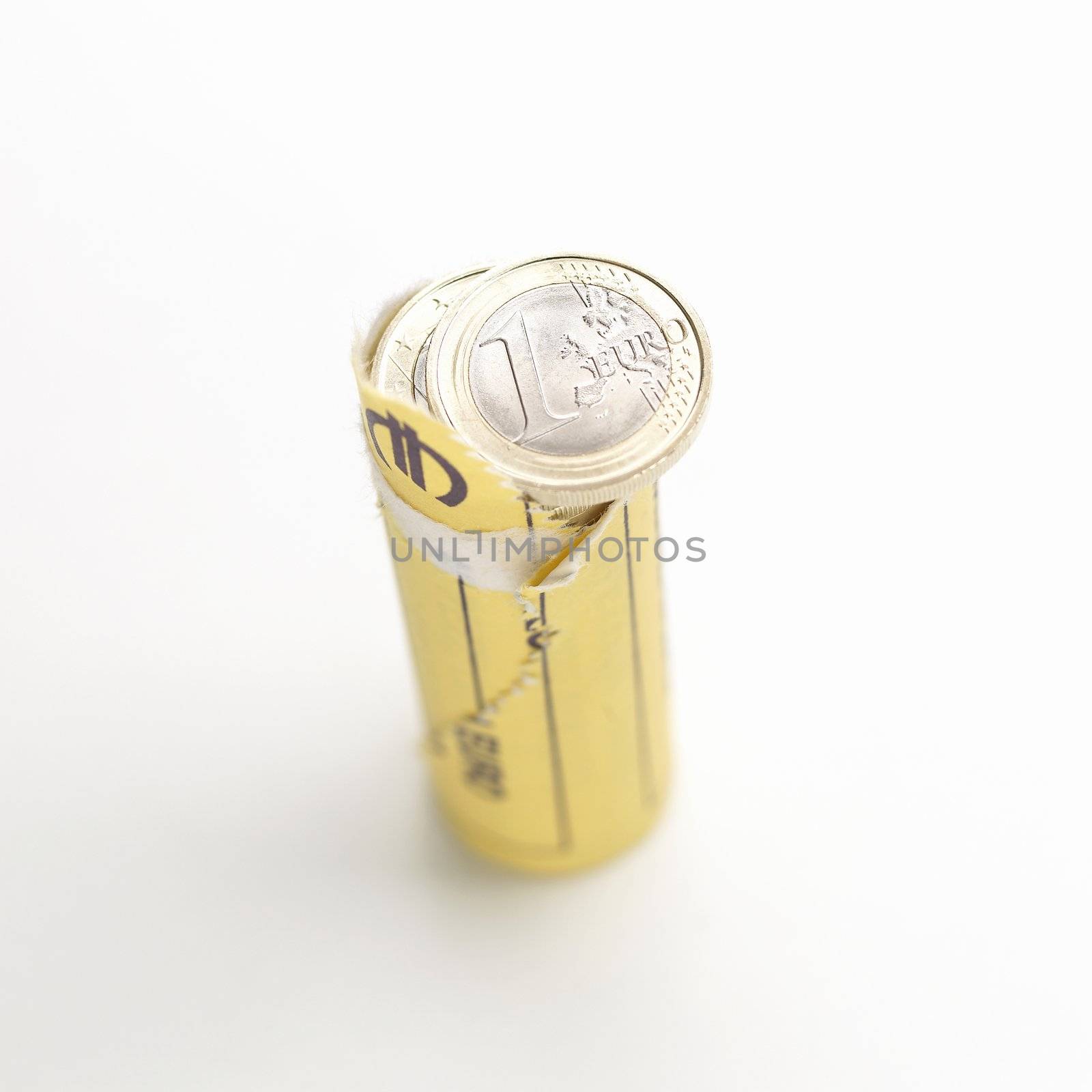 Opened roll of euro coins on white